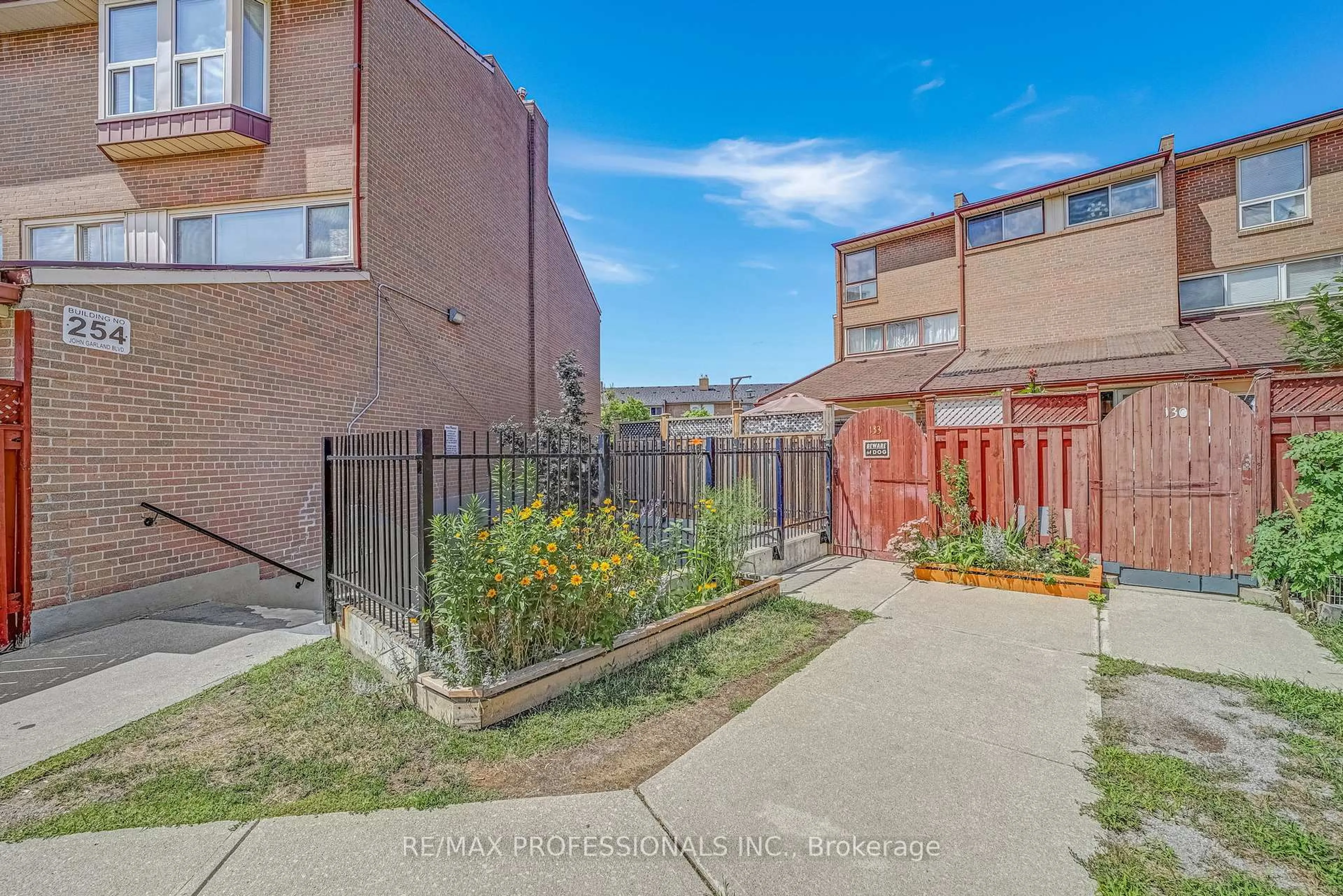A pic from outside/outdoor area/front of a property/back of a property/a pic from drone, street for 256 John Garland Blvd #133, Toronto Ontario M9V 1N8