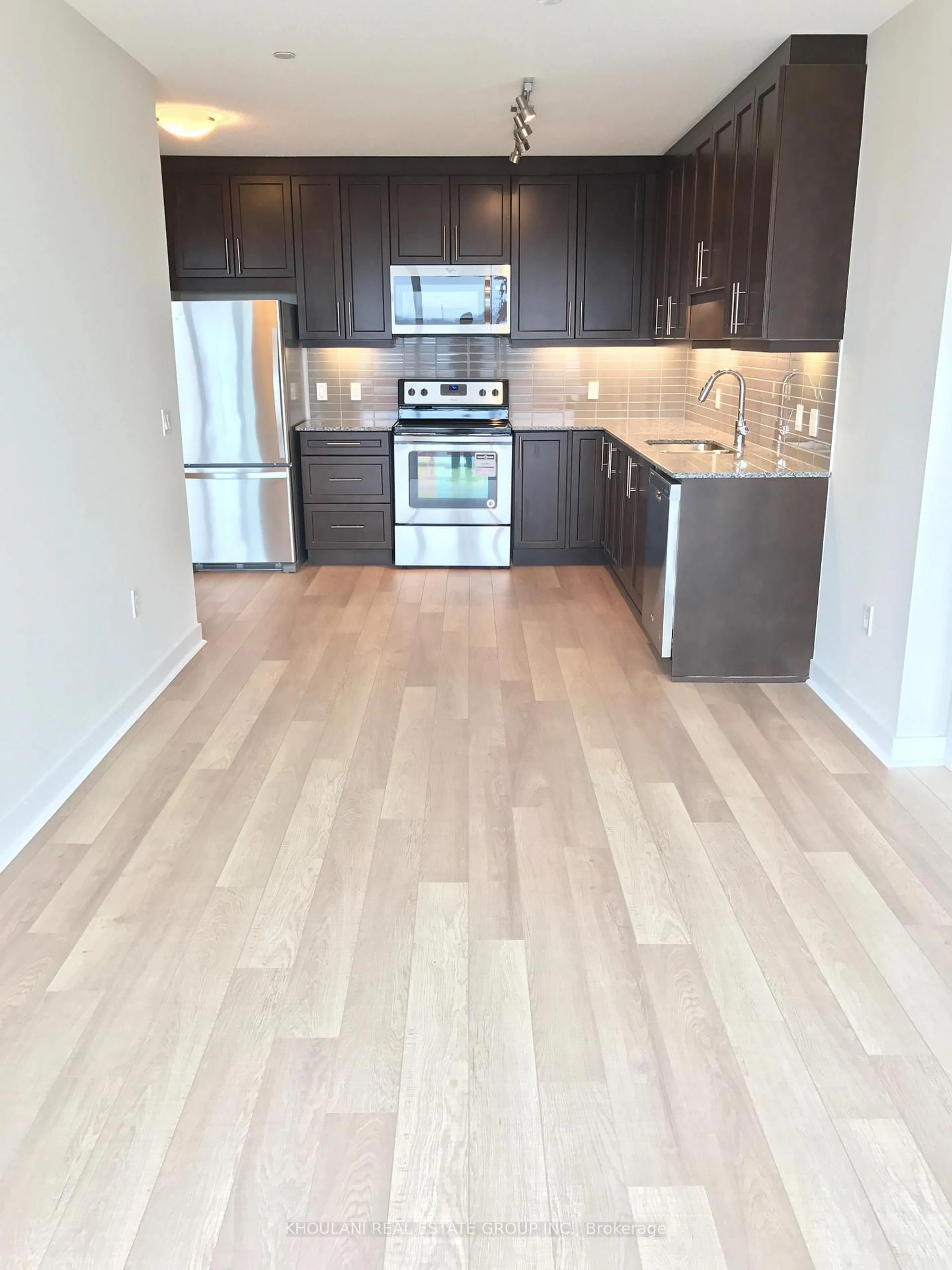 Open concept kitchen, wood/laminate floor for 3975 Grand Park Dr #408, Mississauga Ontario L5B 0K4