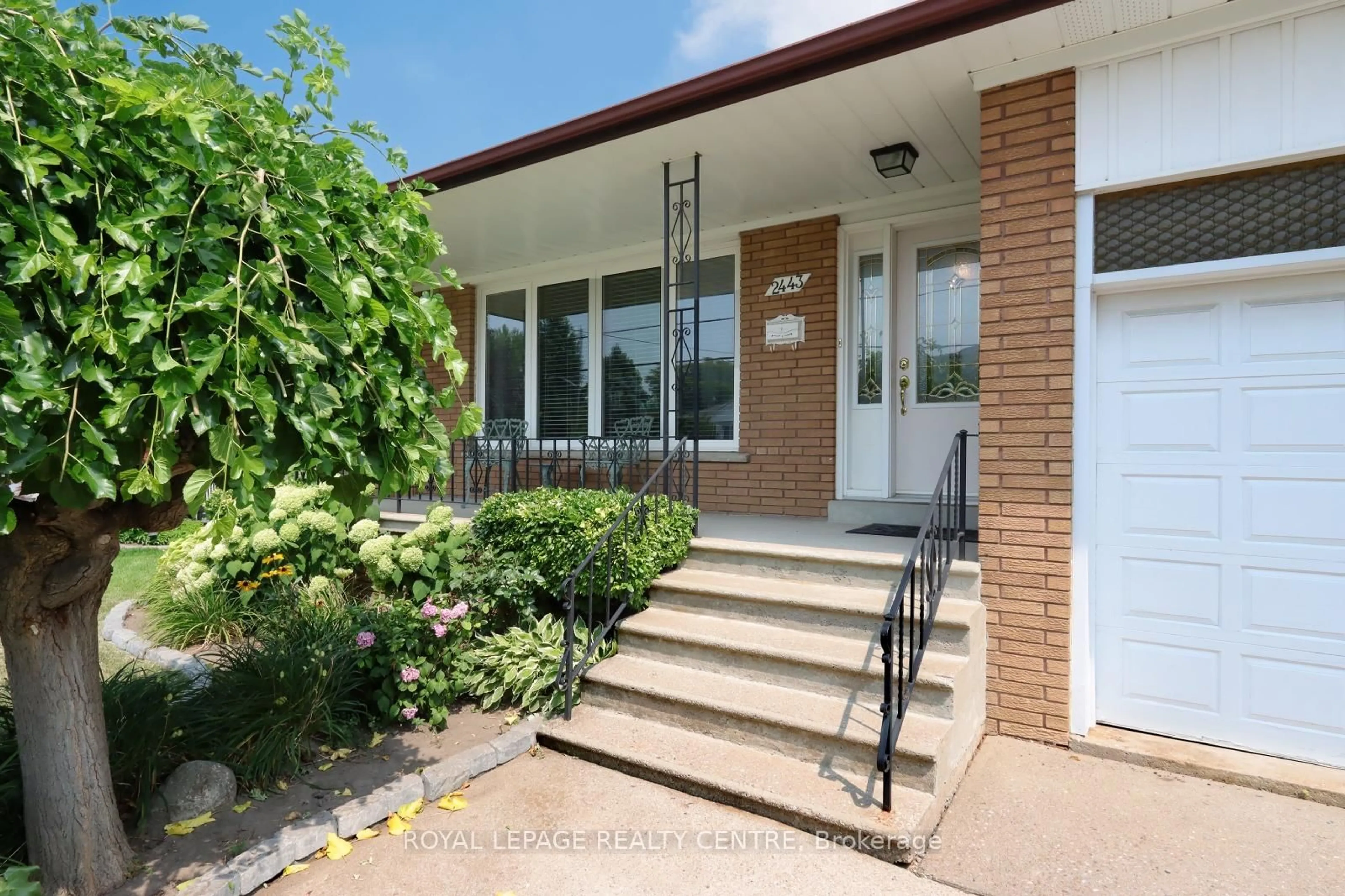 Home with brick exterior material, street for 2443 Cliff Rd, Mississauga Ontario L5A 2P1
