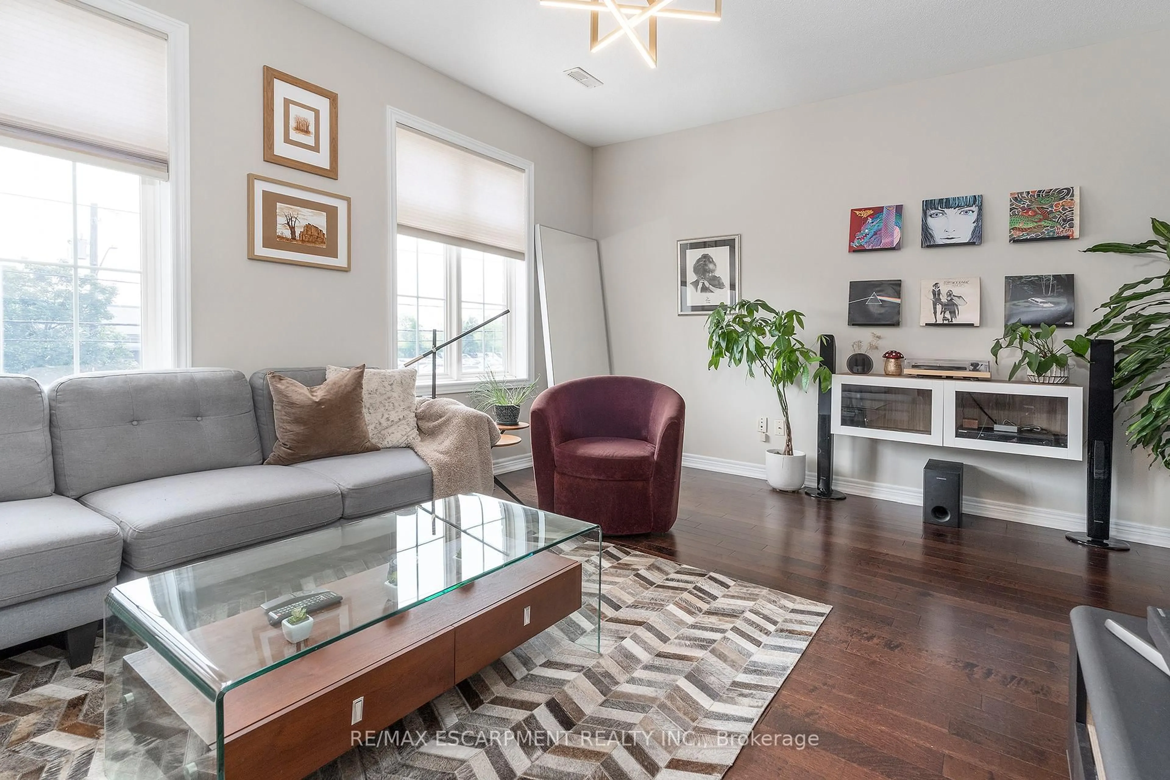 Living room with furniture, wood/laminate floor for 1401 Plains Rd #26, Burlington Ontario L7R 3P8