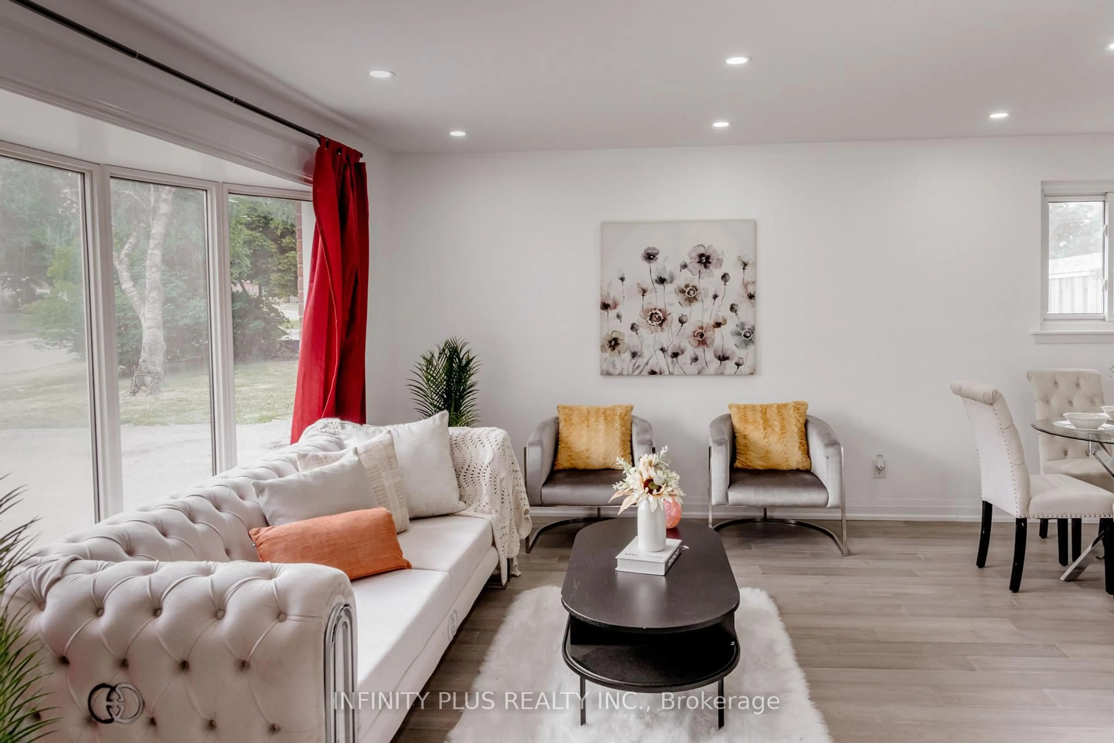 Living room with furniture, wood/laminate floor for 31 Autumn Blvd, Brampton Ontario L6T 2V3