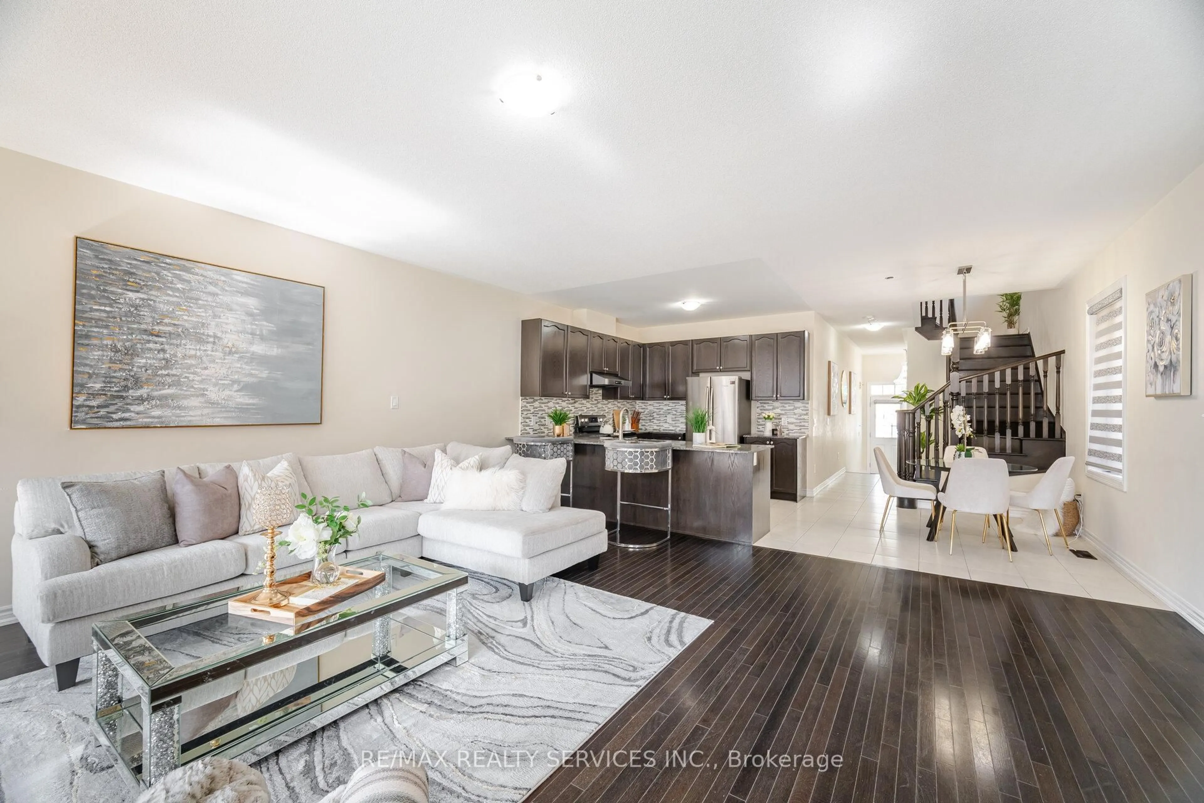 Open concept kitchen, wood/laminate floor for 54 Maple Cider St, Caledon Ontario L7C 4B8