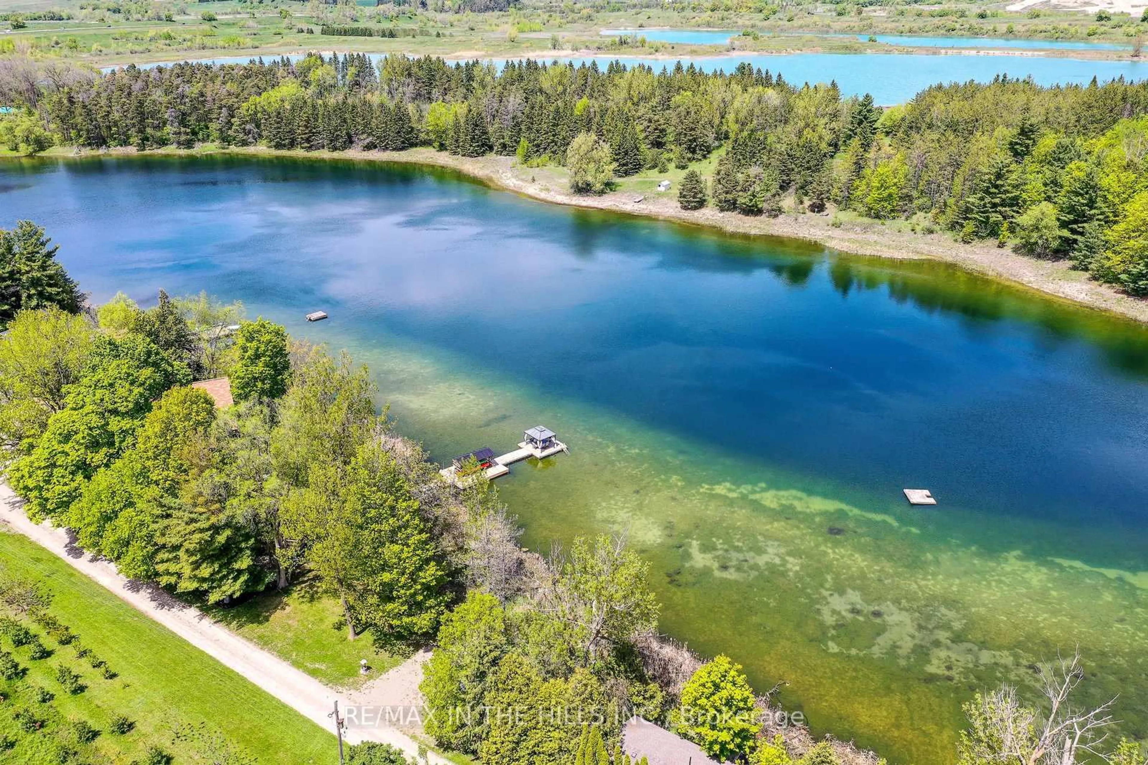 A pic from outside/outdoor area/front of a property/back of a property/a pic from drone, water/lake/river/ocean view for 143 Green Lake Rd #143, Caledon Ontario L7K 0S4
