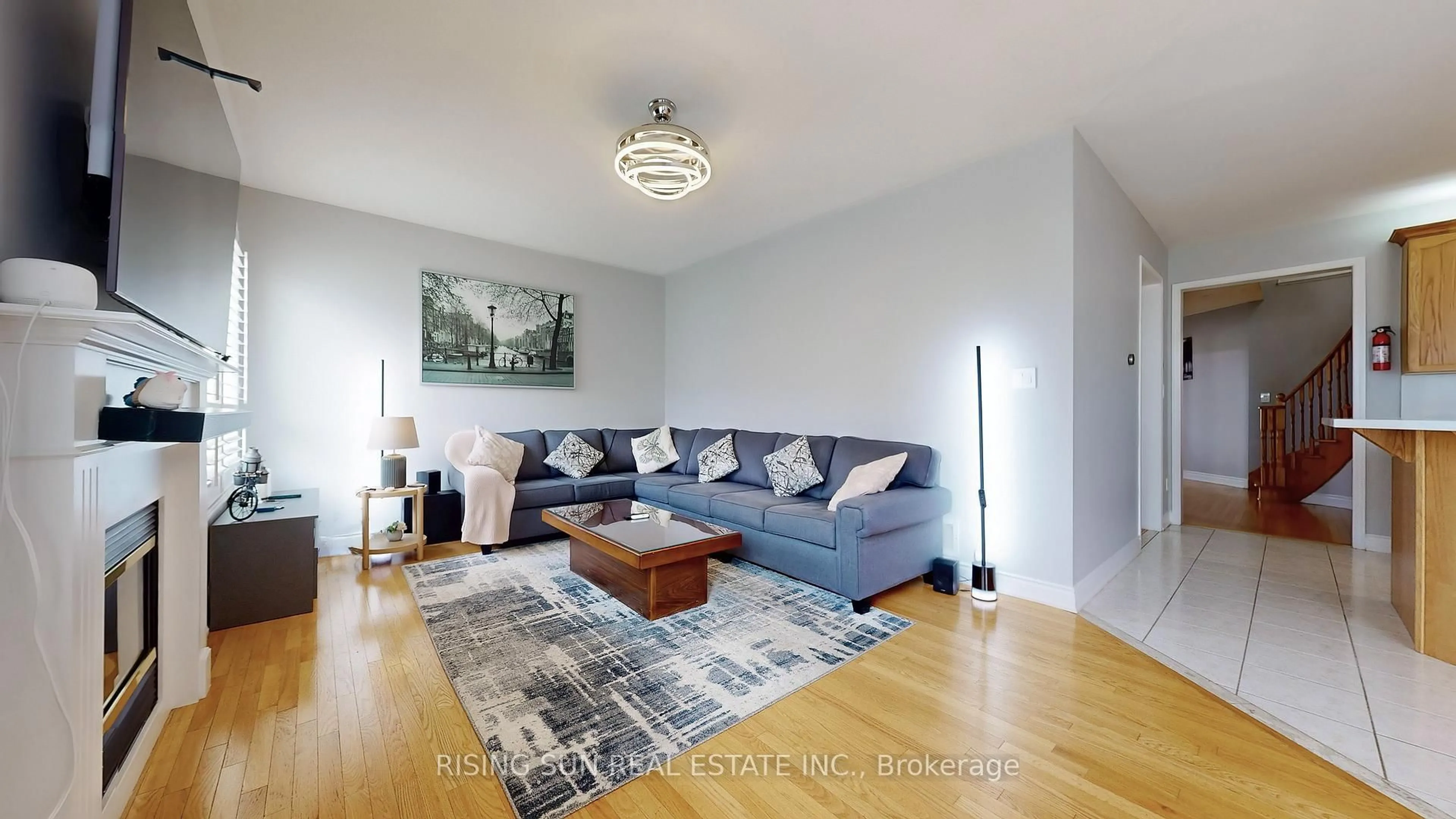 Living room with furniture, wood/laminate floor for 15 Mario St, Brampton Ontario L6P 1N1