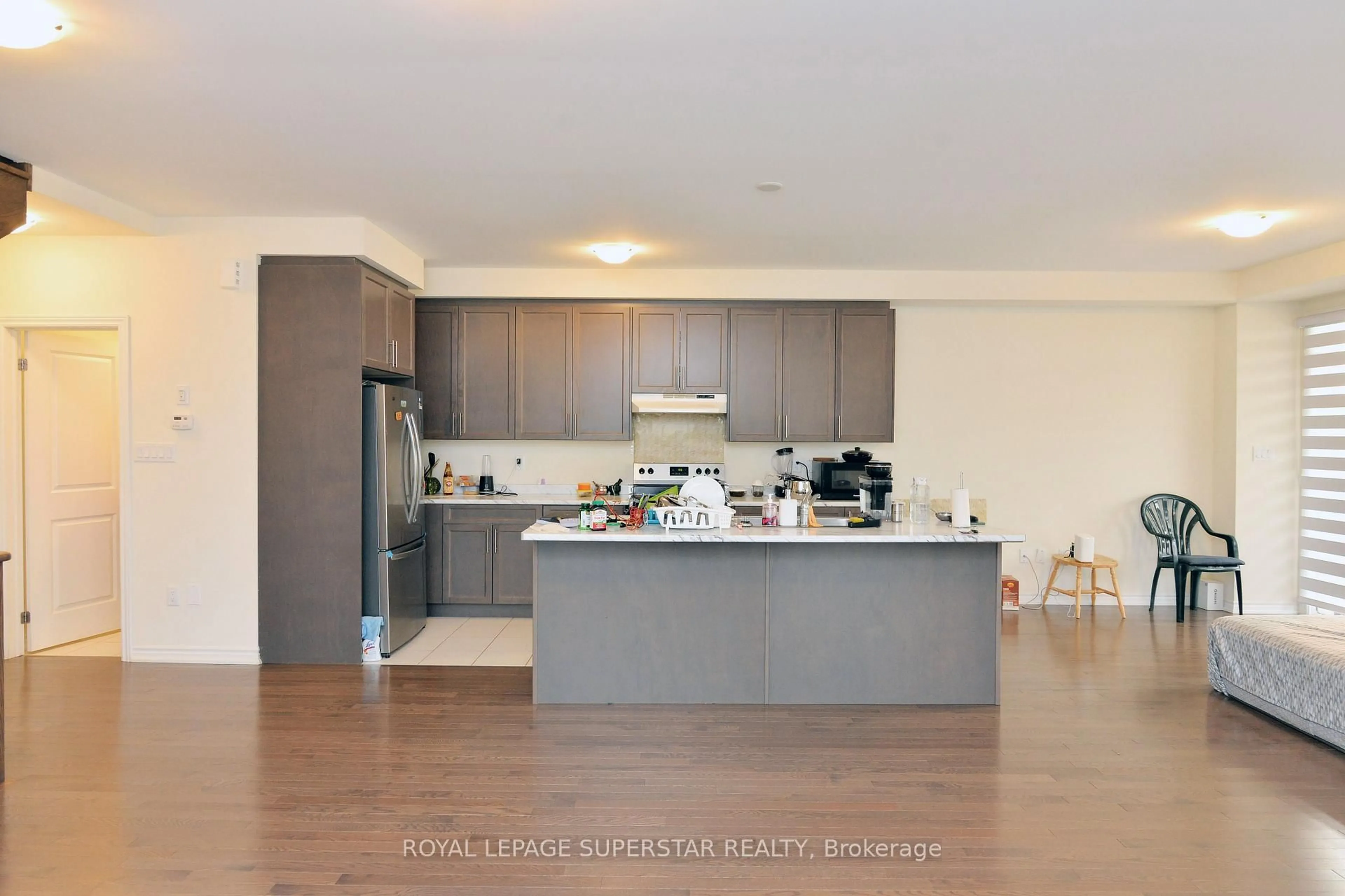Open concept kitchen, wood/laminate floor for 98 DONALD FICHT Cres, Brampton Ontario L7A 5H8