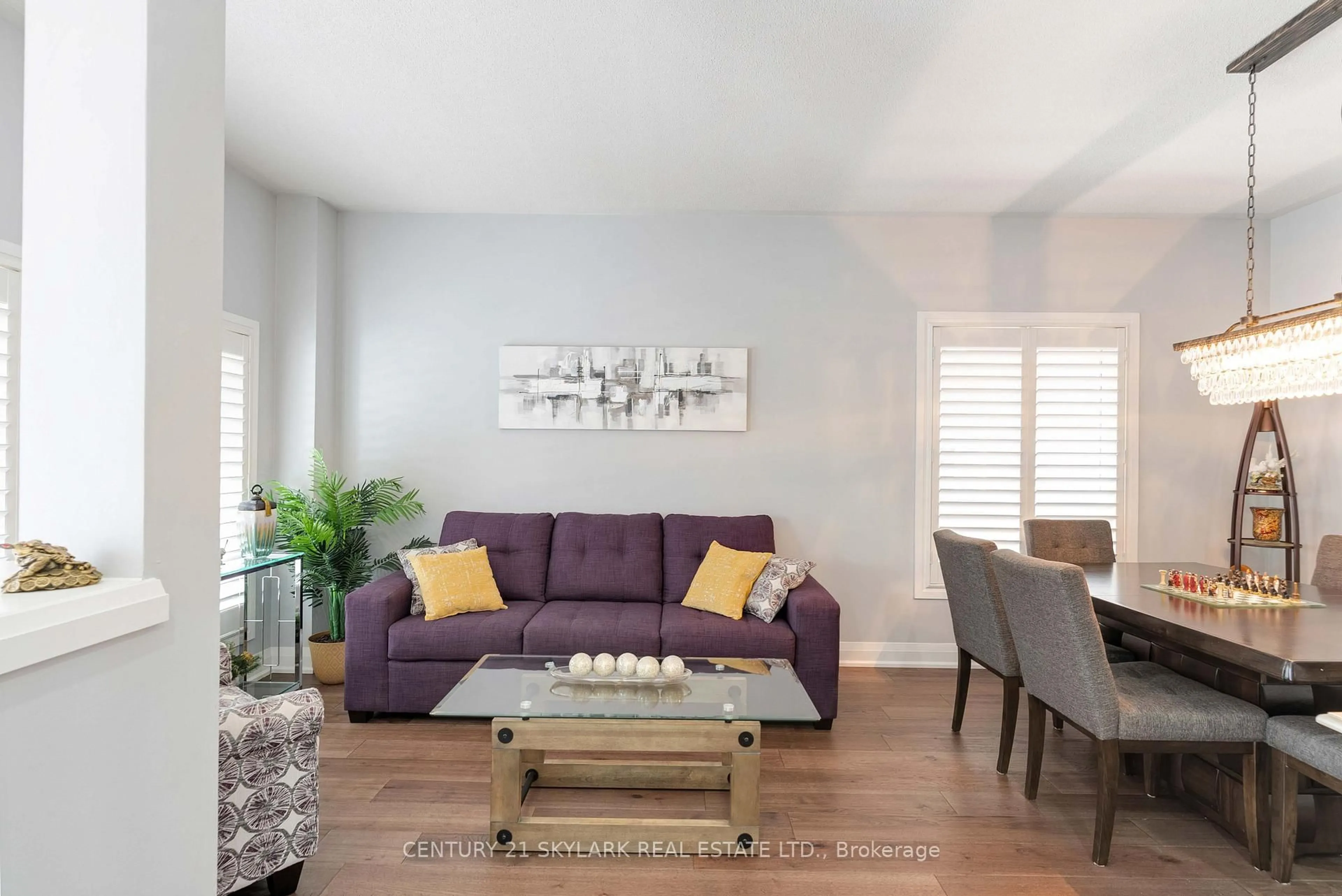 Living room with furniture, wood/laminate floor for 26 Windswept Tr, Brampton Ontario L7A 0J1