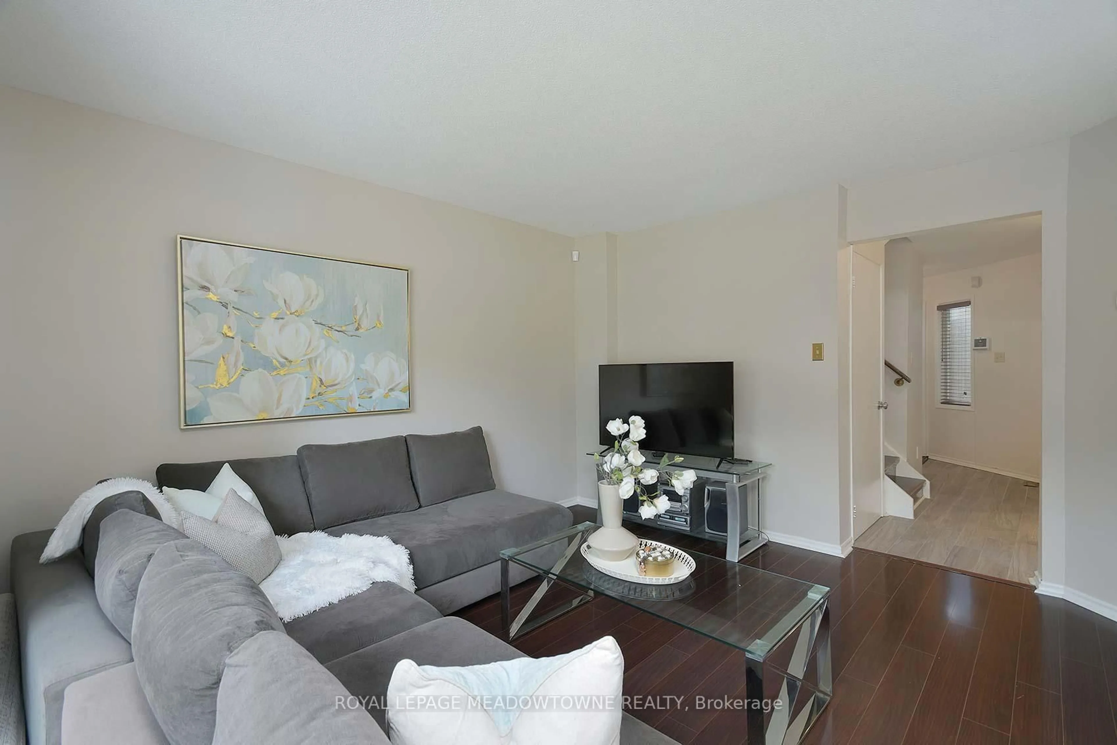 Living room with furniture, wood/laminate floor for 3600 Colonial Dr #2, Mississauga Ontario L5L 5P5