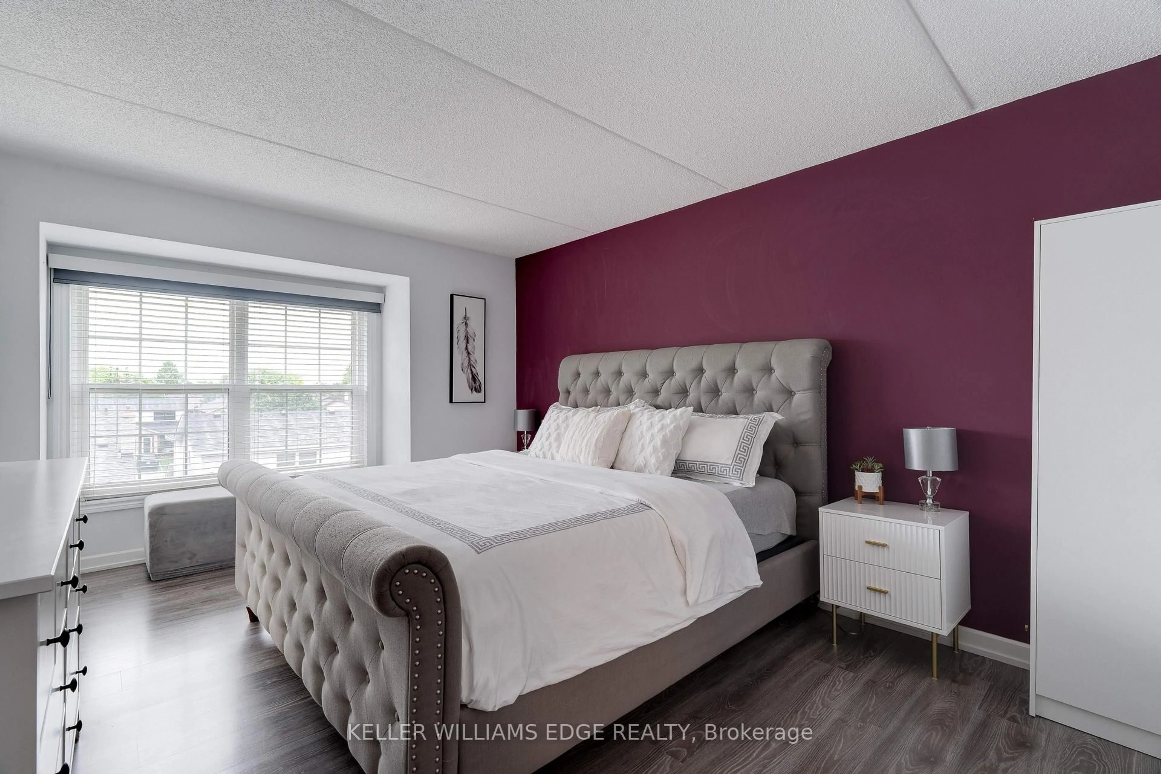 Bedroom with bed, wood/laminate floor for 1800 Walkers Line #302, Burlington Ontario L7M 4V2