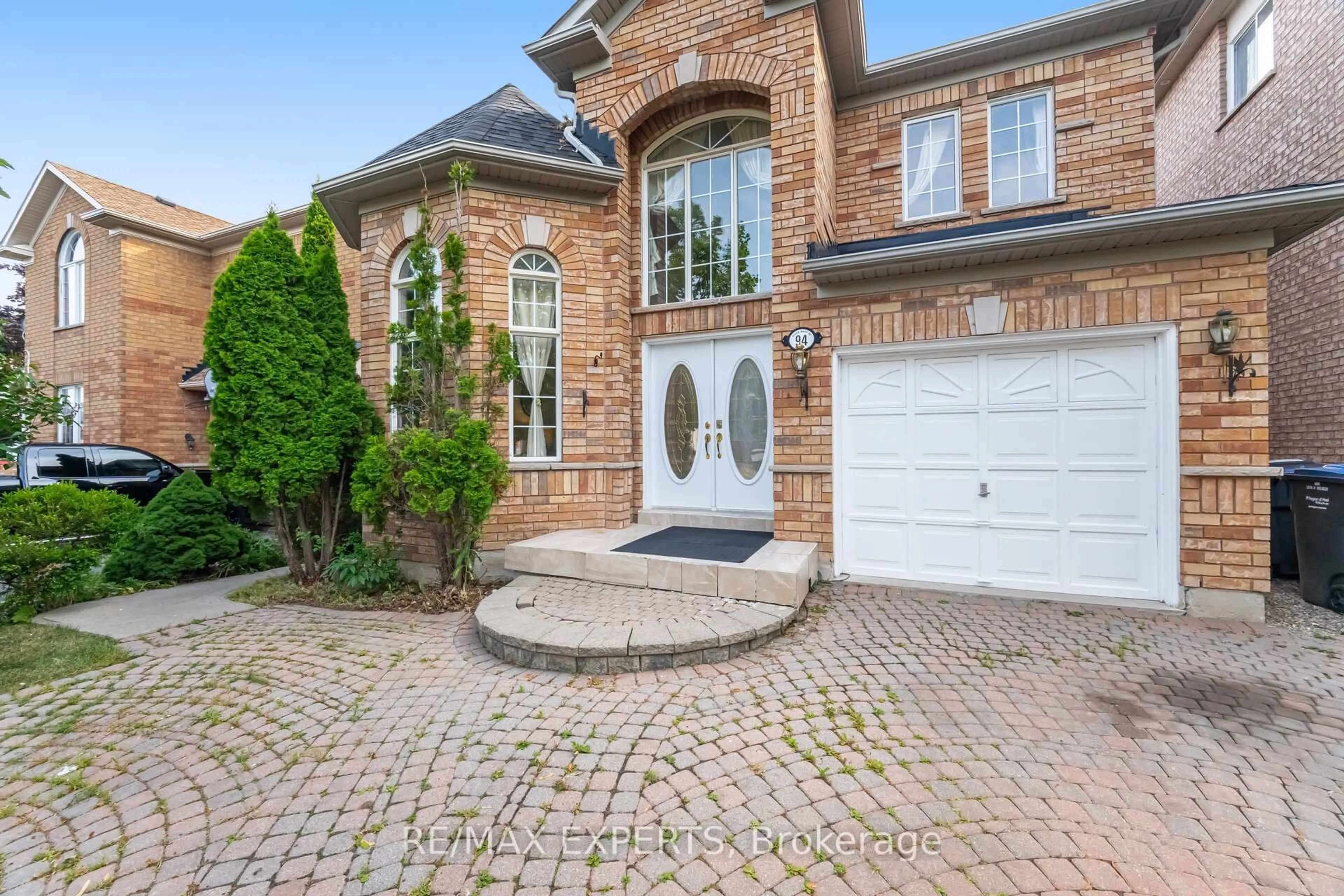 Home with brick exterior material, street for 94 Queen Mary Dr, Brampton Ontario L7A 2K7