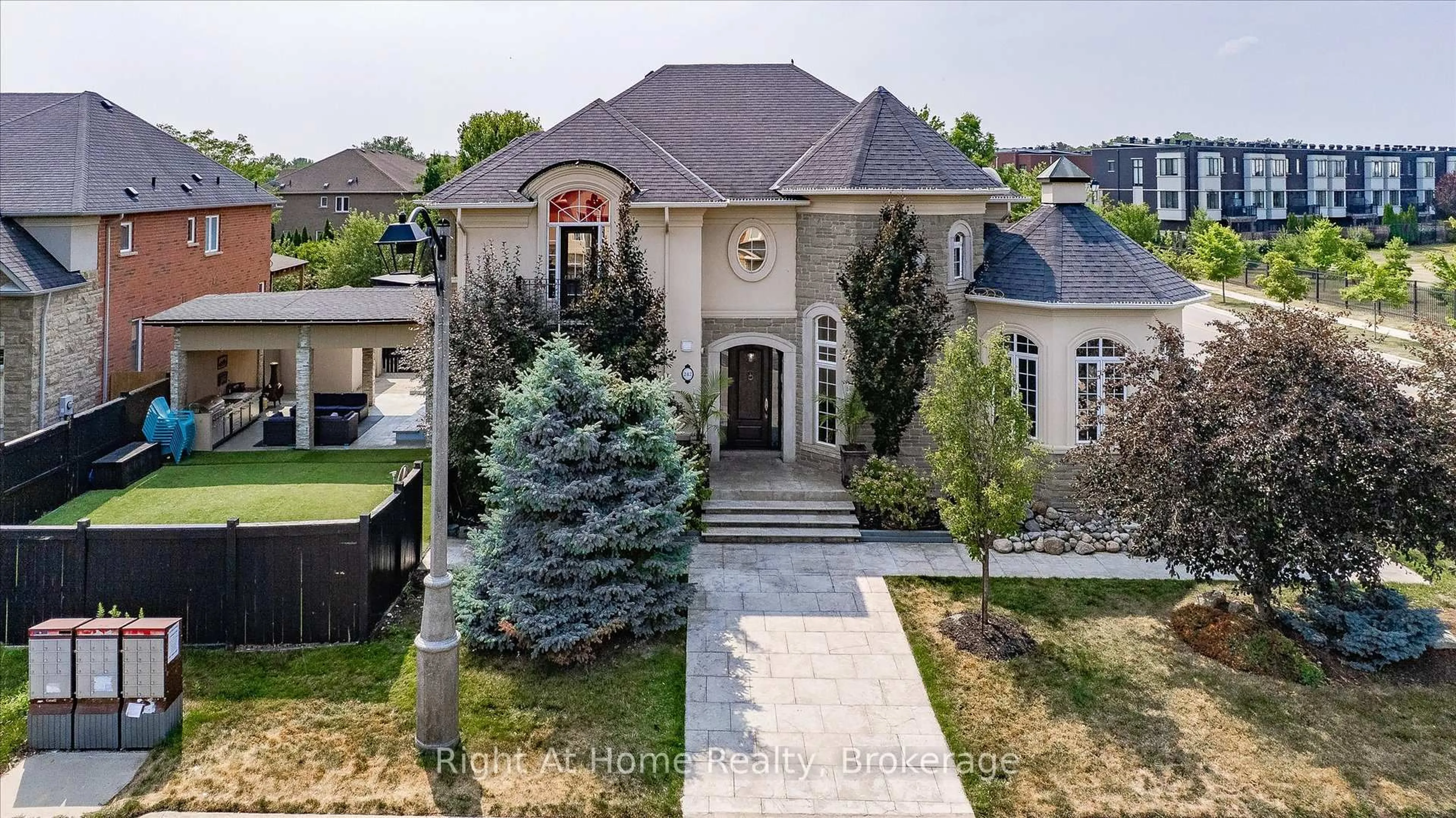 Home with brick exterior material, street for 242 Milkweed Way, Oakville Ontario L6L 0A6