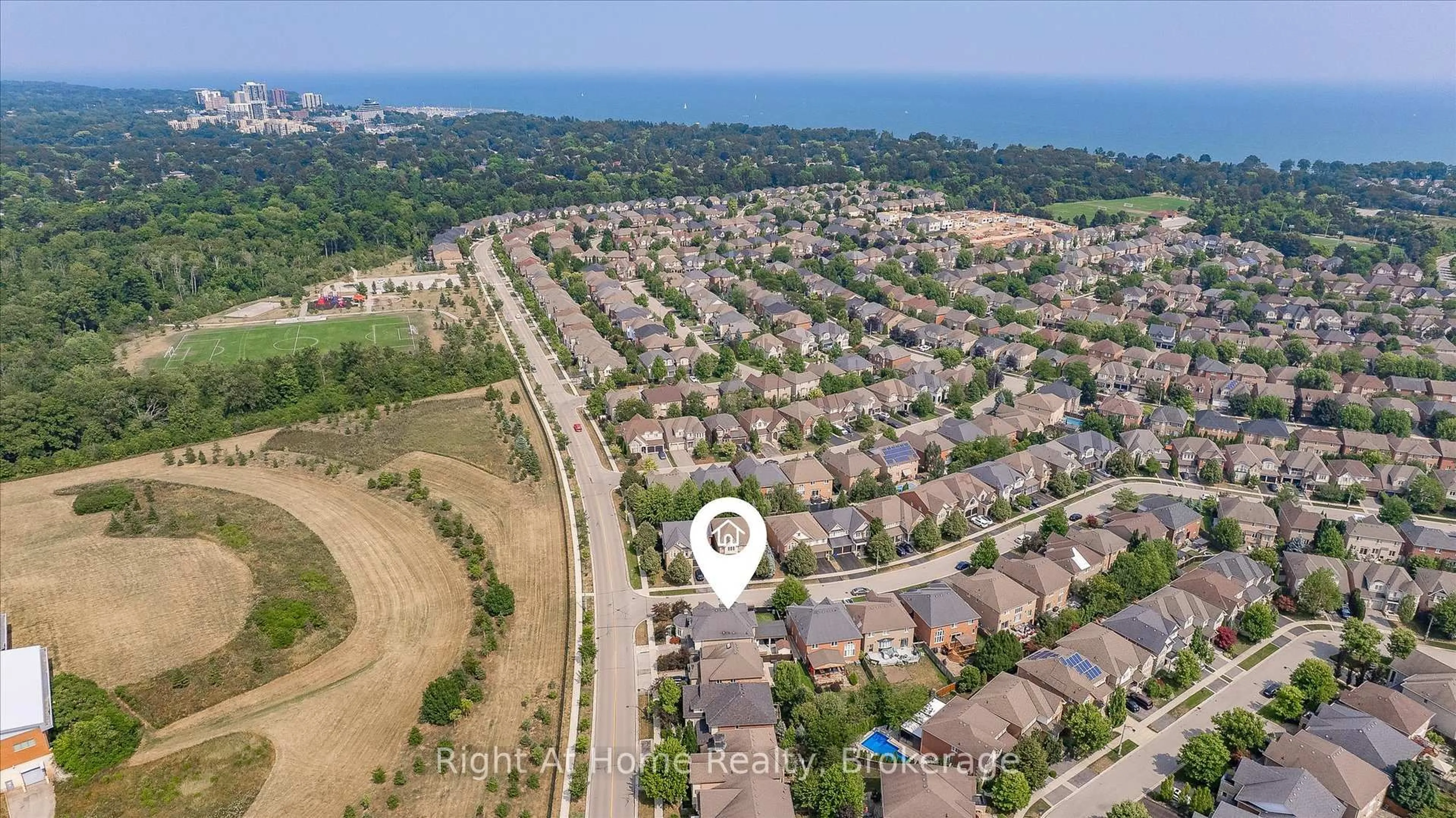 A pic from outside/outdoor area/front of a property/back of a property/a pic from drone, street for 242 Milkweed Way, Oakville Ontario L6L 0A6