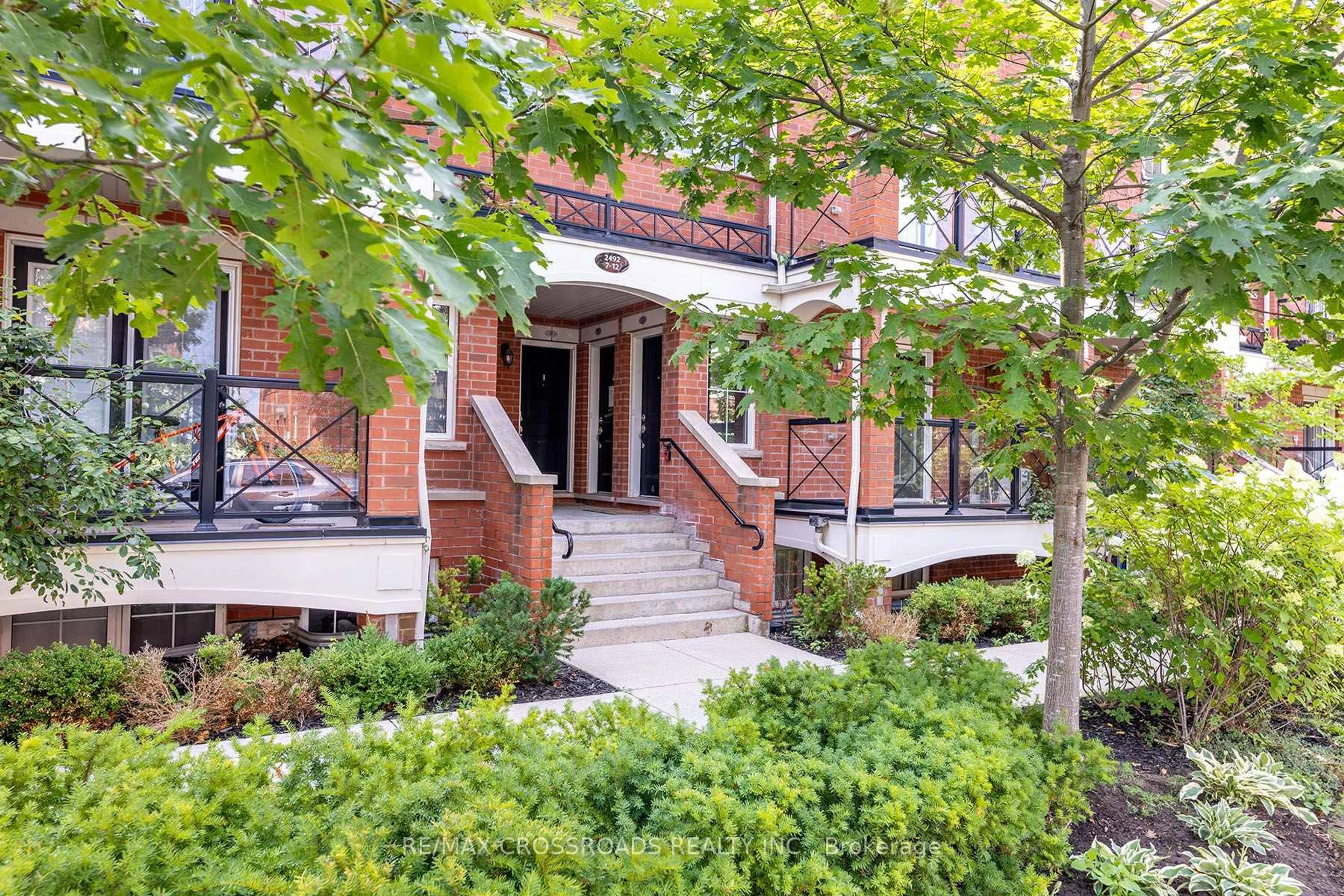 Home with brick exterior material, street for 2492 Post Rd #7, Oakville Ontario L6H 0J2