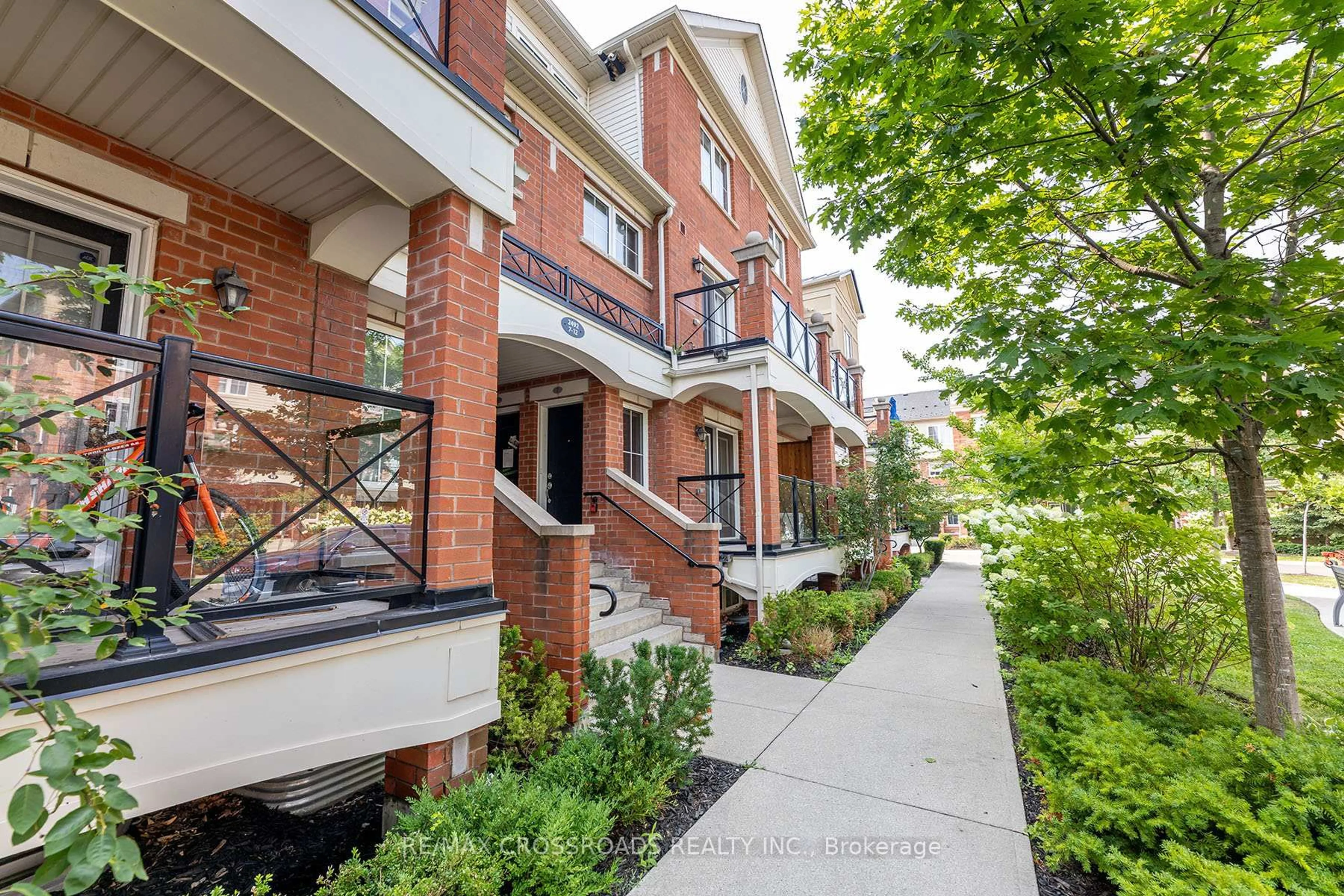 Home with brick exterior material, street for 2492 Post Rd #7, Oakville Ontario L6H 0J2