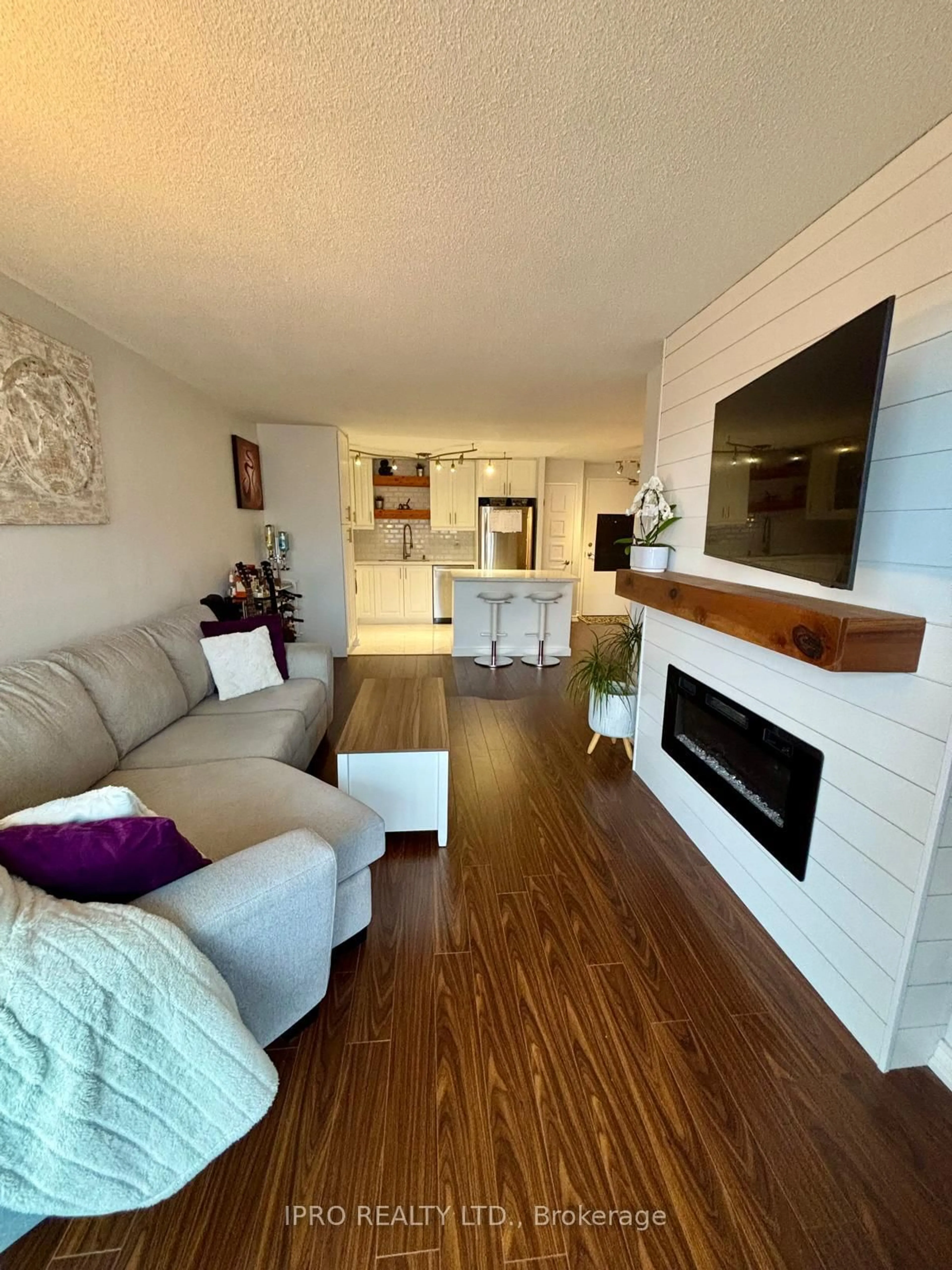 Living room with furniture, wood/laminate floor for 145 Hillcrest Ave #2310, Mississauga Ontario L5B 3Z1