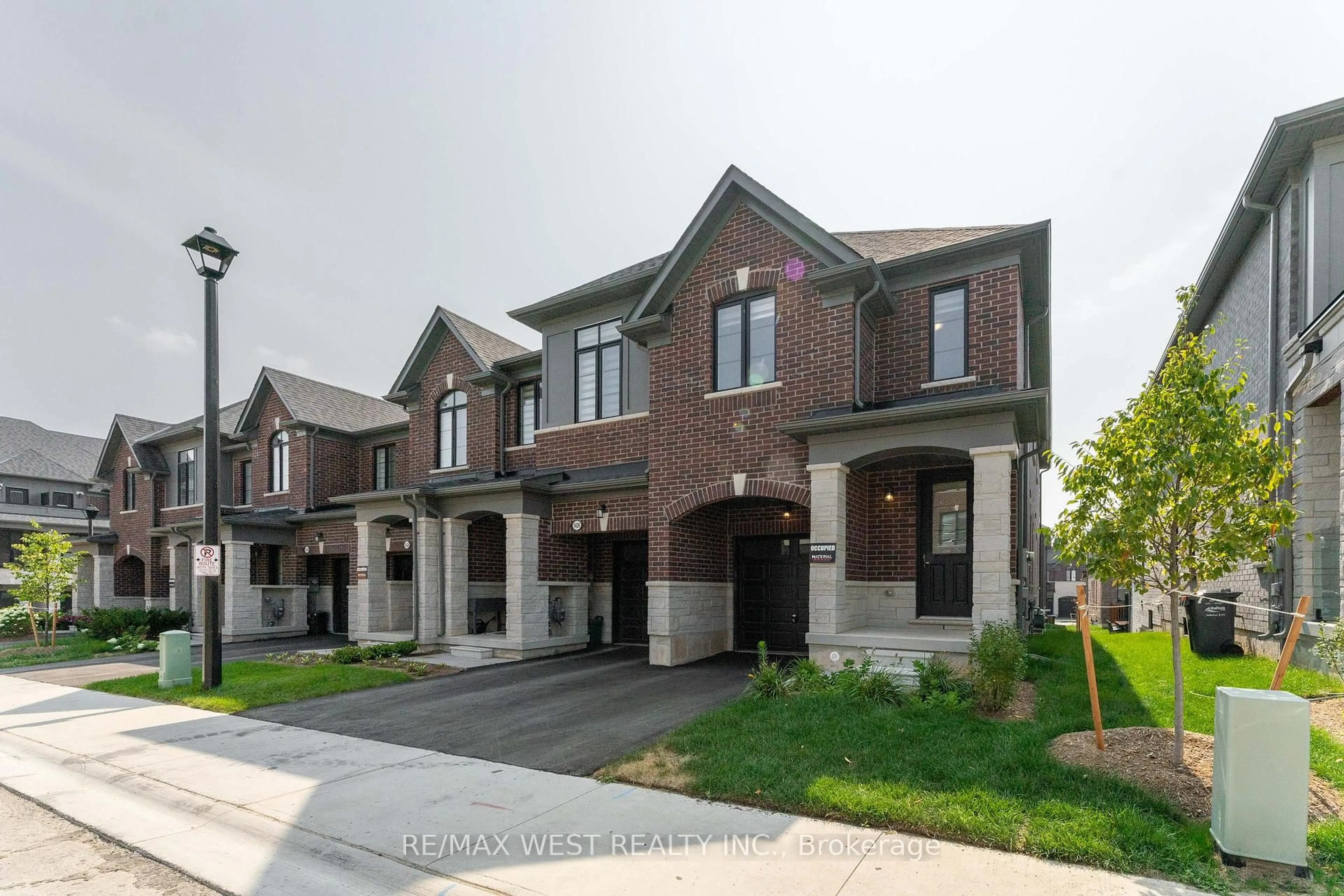 Home with brick exterior material, street for 1424 National Common, Burlington Ontario L7P 0V7