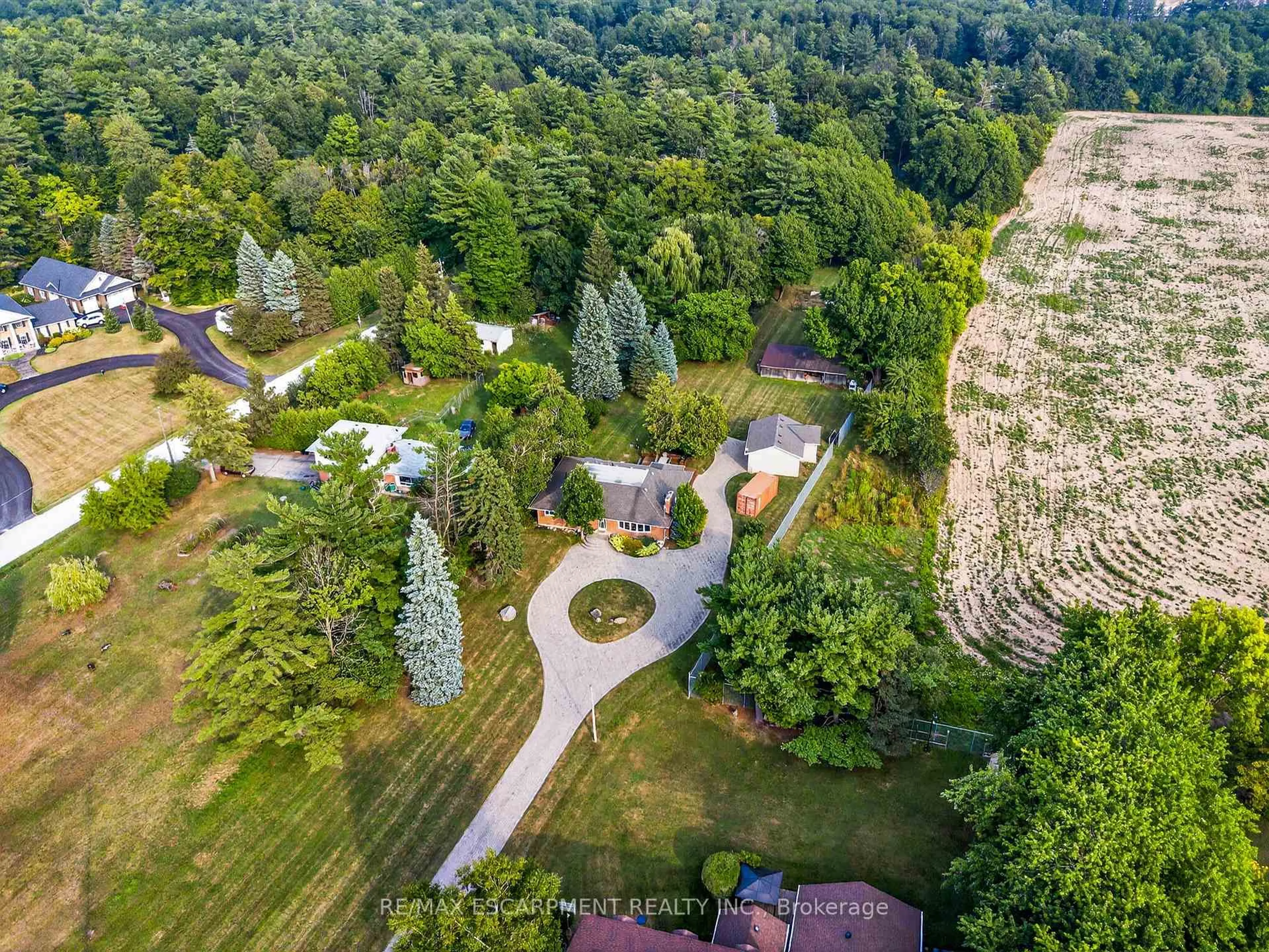 A pic from outside/outdoor area/front of a property/back of a property/a pic from drone, forest/trees view for 9286 5 SIDE Rd, Milton Ontario L9T 7K8