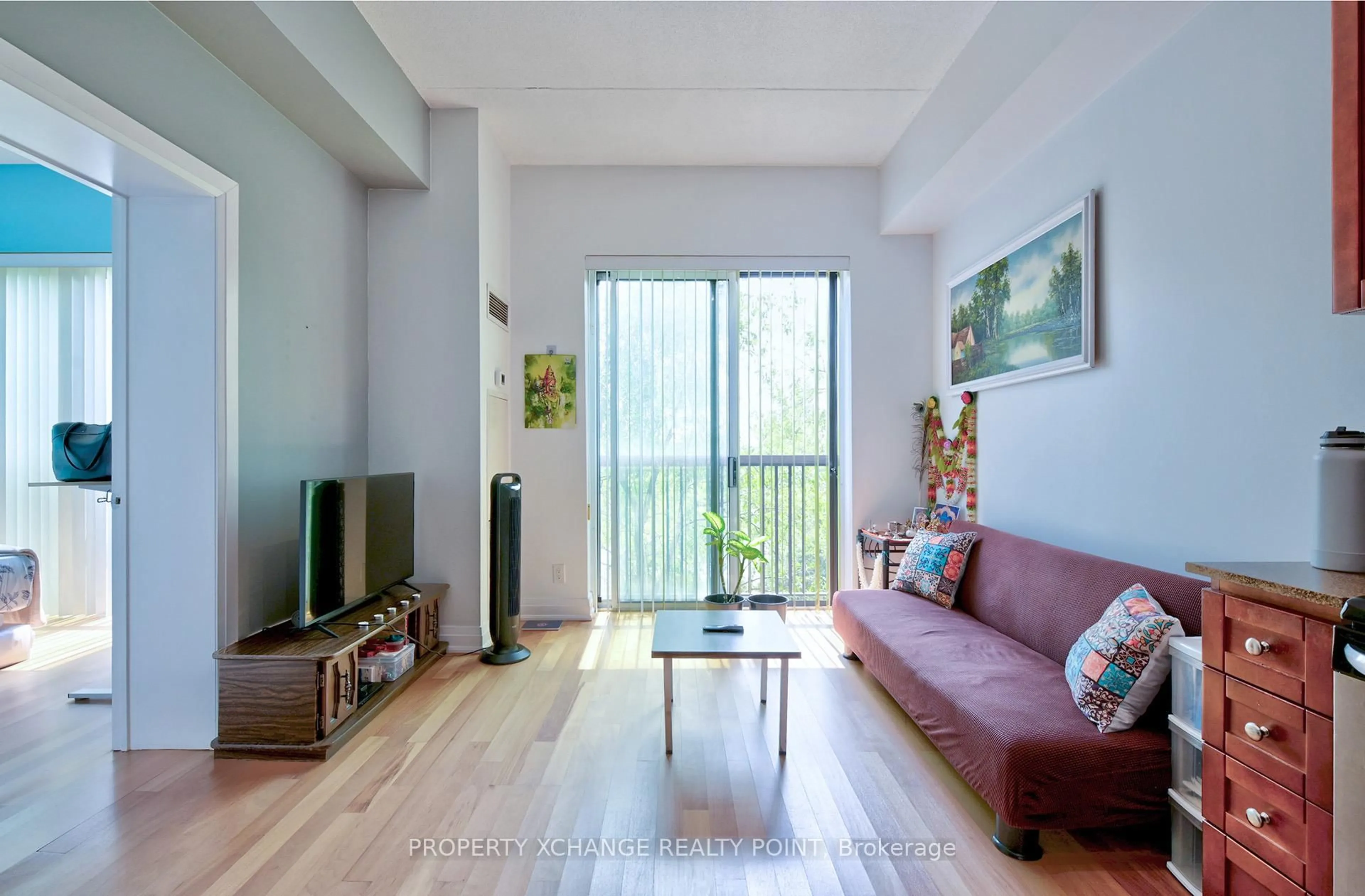 Living room with furniture, wood/laminate floor for 2737 keele St #213, Toronto Ontario M3M 2E9