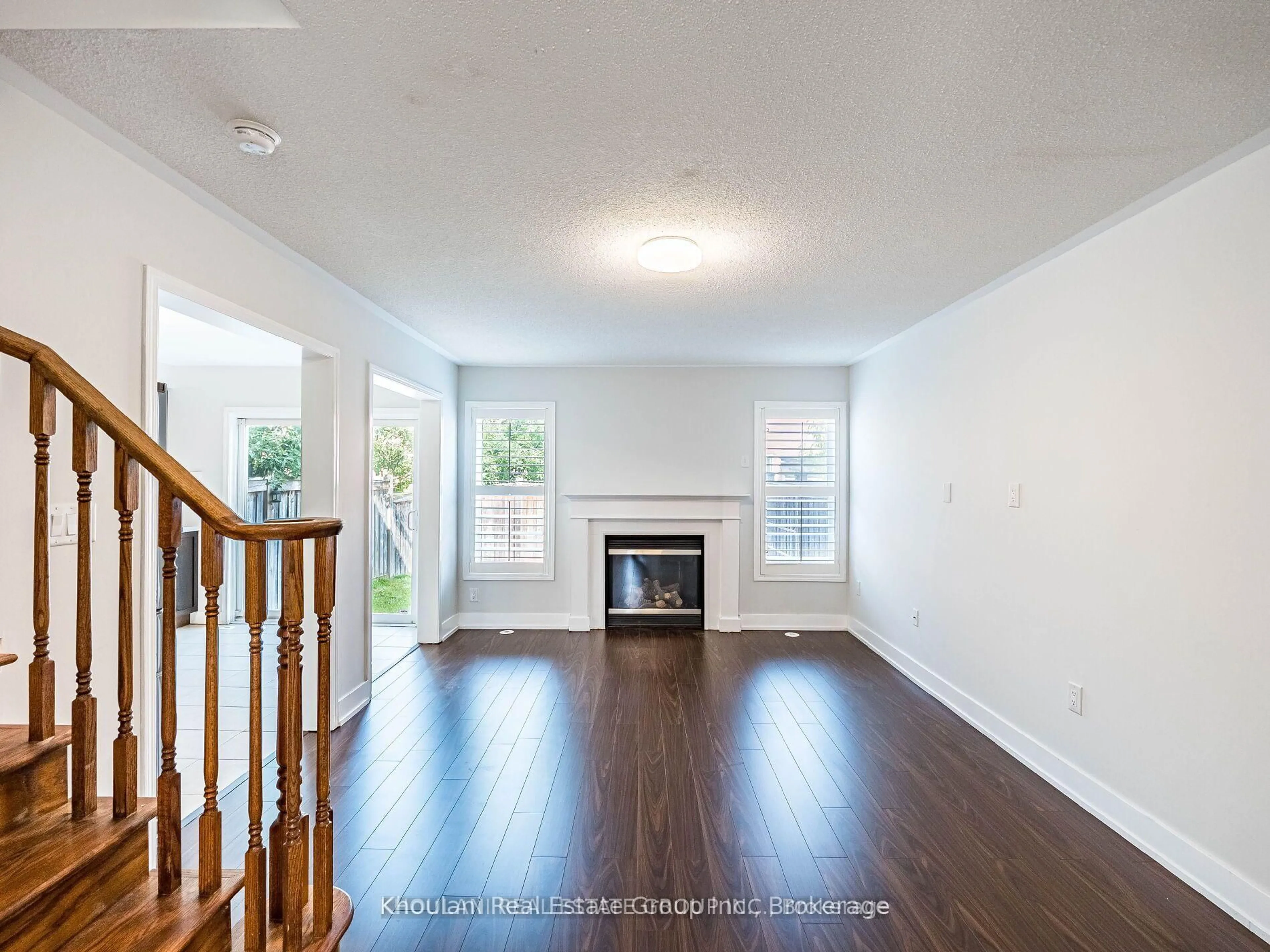 Living room with furniture, wood/laminate floor for 32 Van Fleet Terr, Milton Ontario L9T 0Y4
