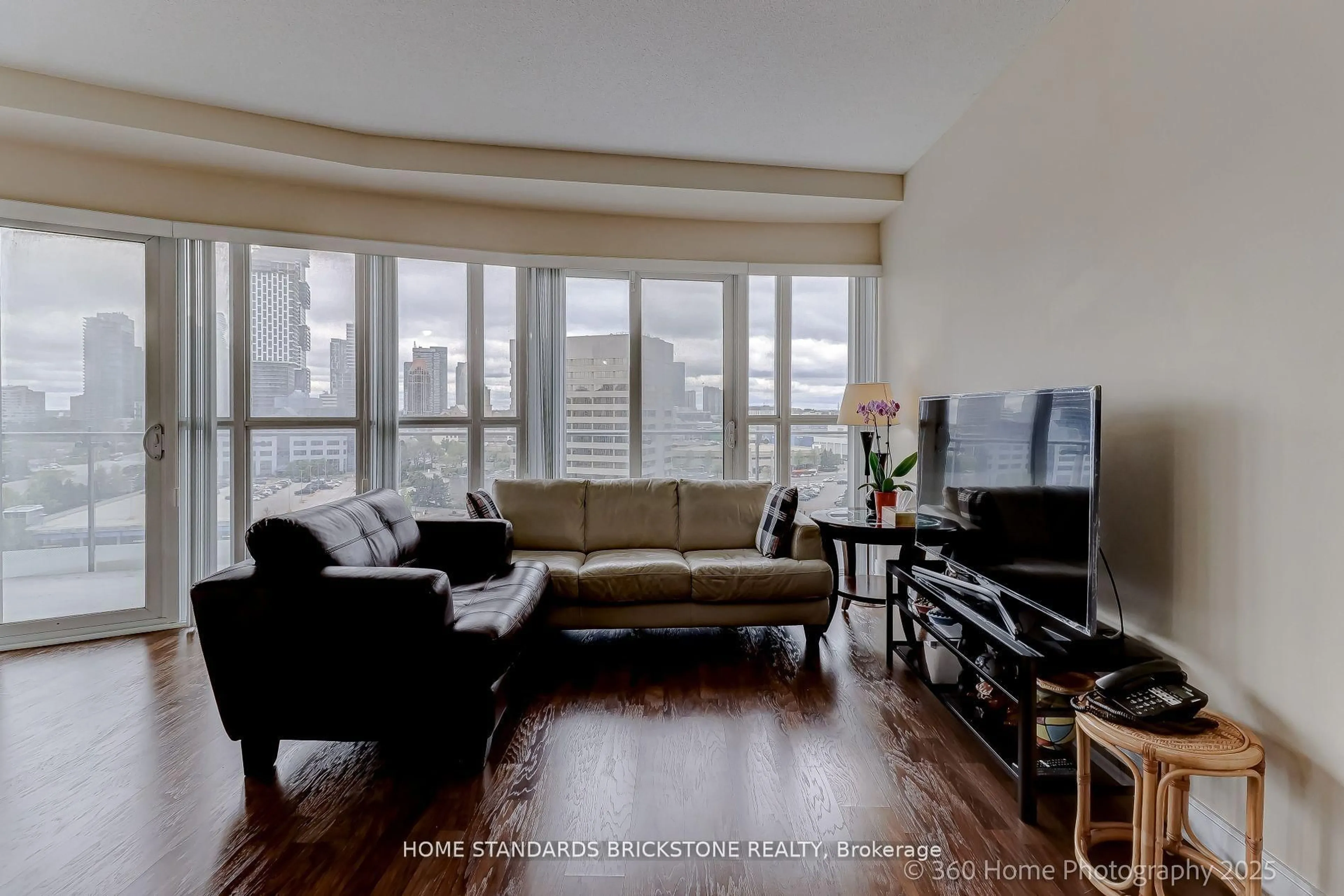 Living room with furniture, wood/laminate floor for 50 Absolute Ave #1106, Mississauga Ontario L4Z 0A8