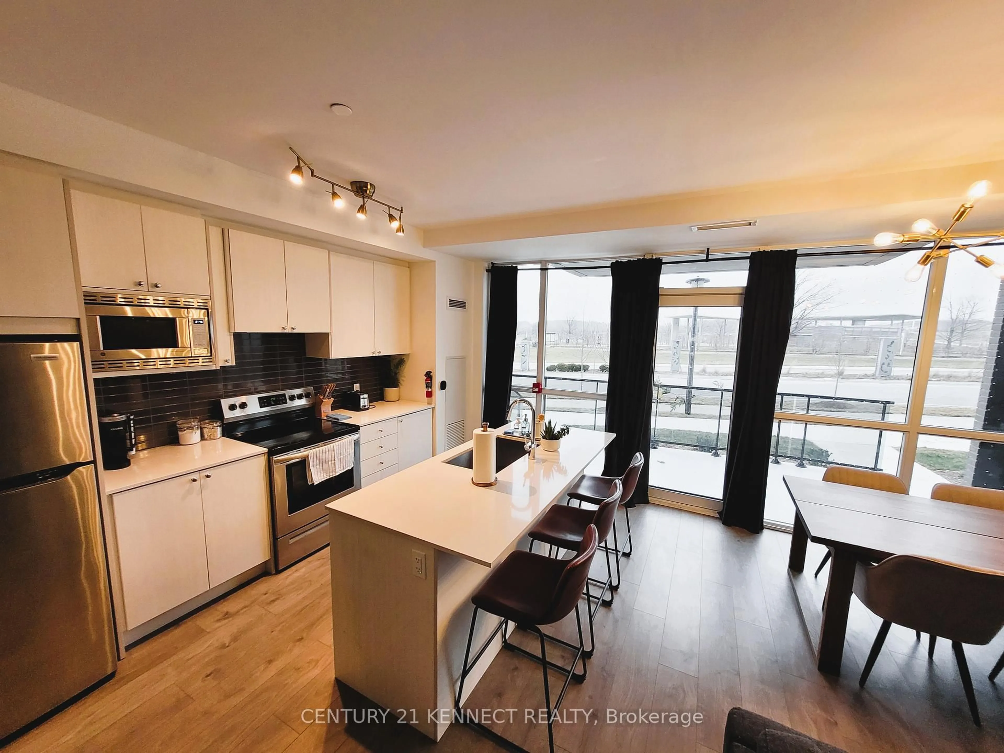 Open concept kitchen, wood/laminate floor for 60 George Butchart Dr #TH2, Toronto Ontario M3K 0E1