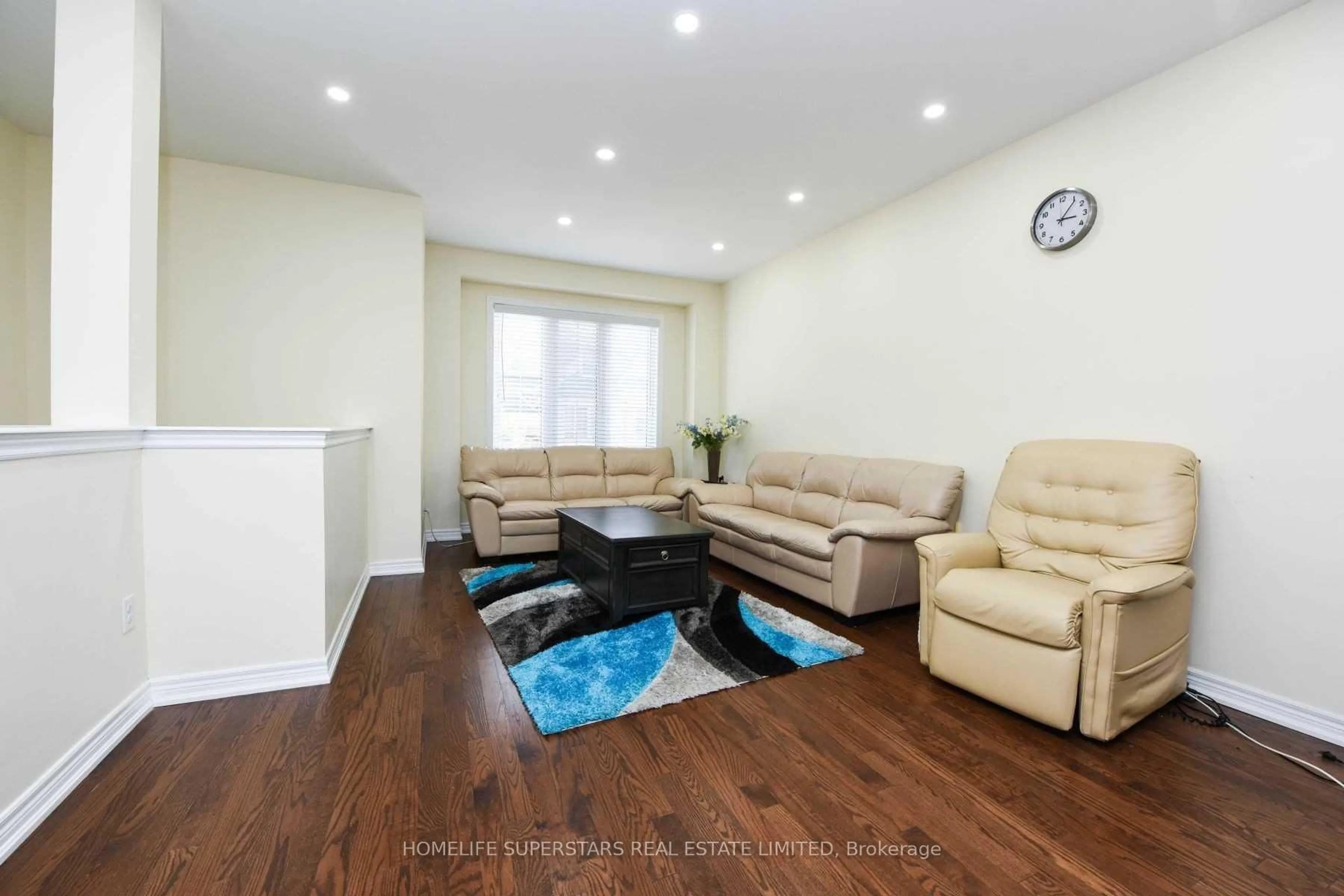 Living room with furniture, wood/laminate floor for 50 Sea Drifter Cres, Brampton Ontario L6P 4B2