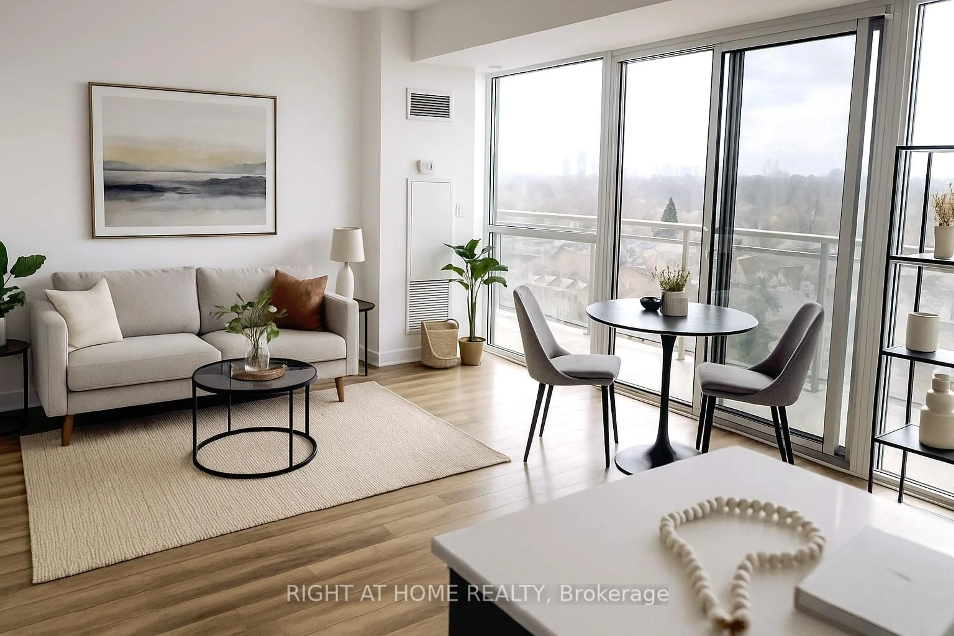 Living room with furniture, wood/laminate floor for 5101 Dundas St #902, Toronto Ontario M9A 1C1