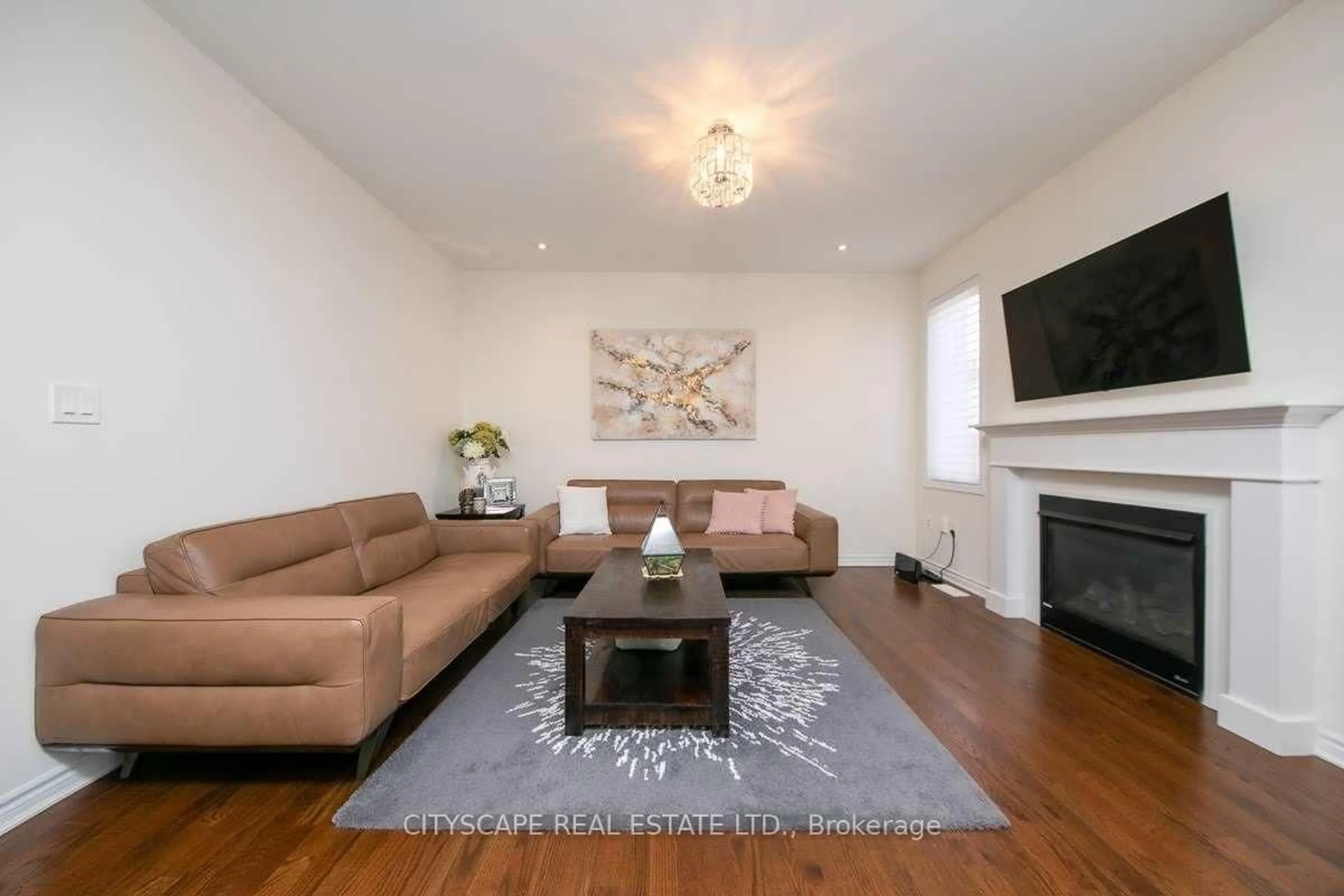 Living room with furniture, wood/laminate floor for 141 Hatt Crt, Milton Ontario L9E 1G7