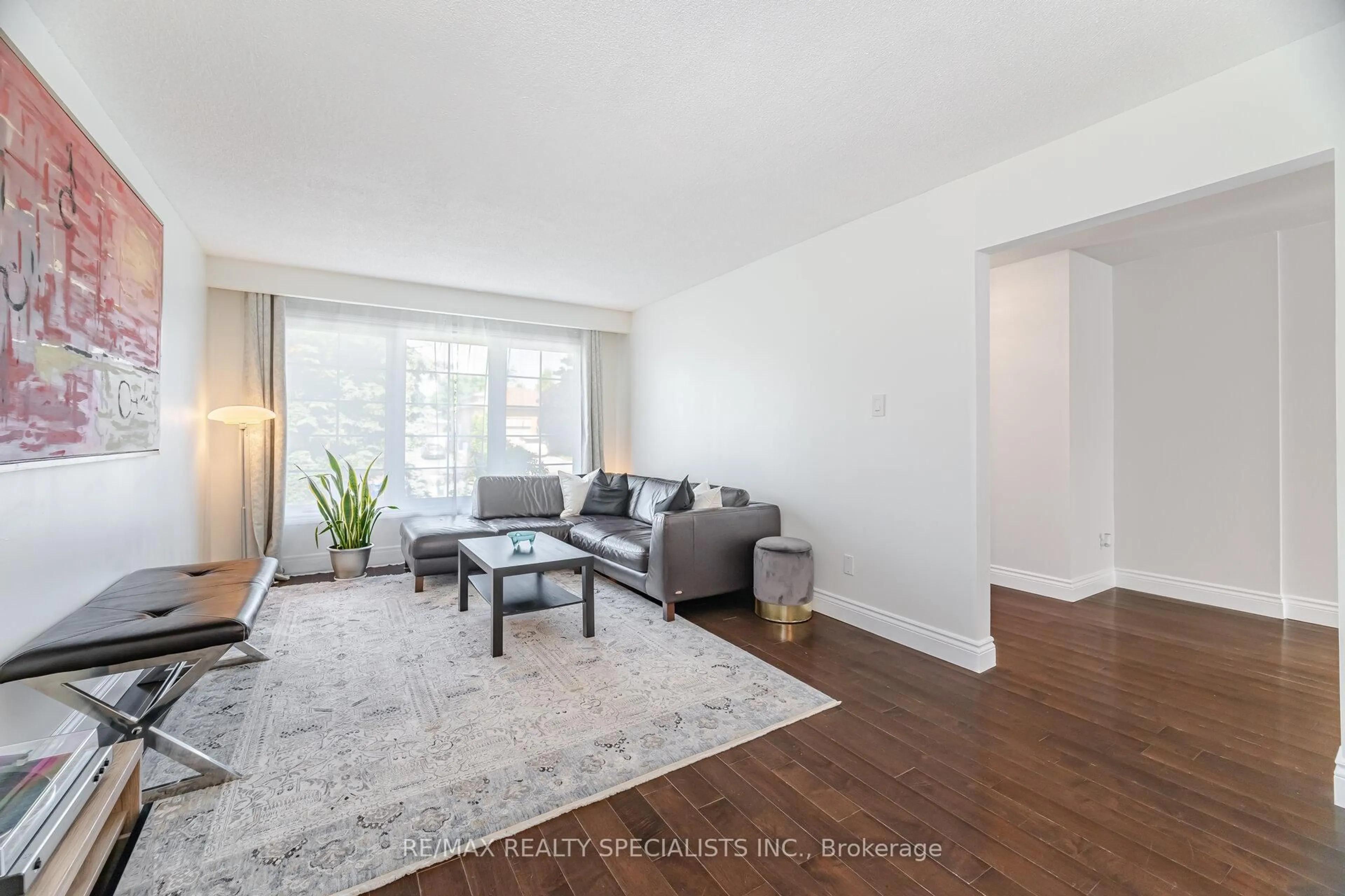 Living room with furniture, wood/laminate floor for 796 Childs Dr, Milton Ontario L9T 4J2