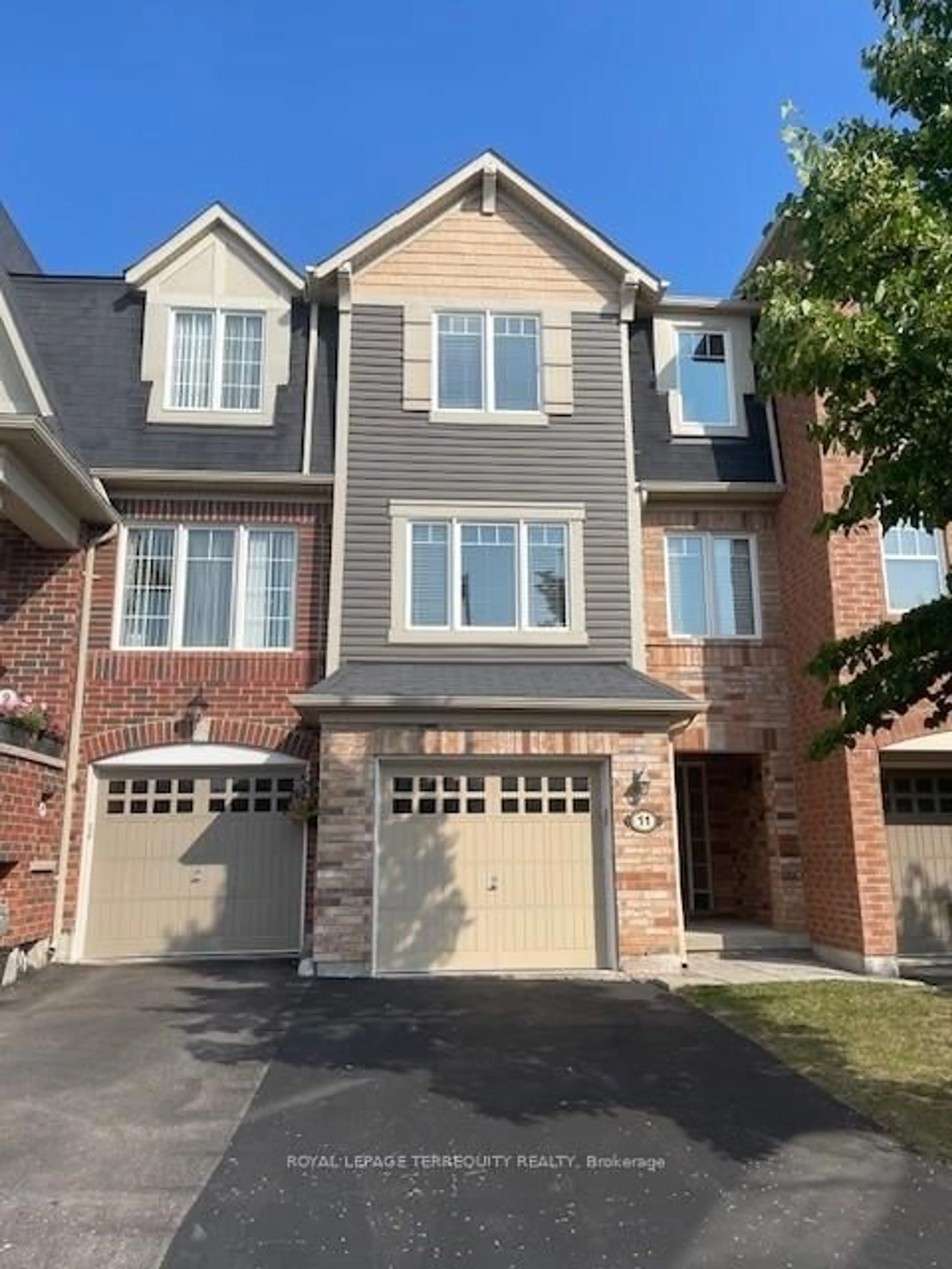 Home with brick exterior material, street for 11 Signature Lane, Brampton Ontario L7A 0T2