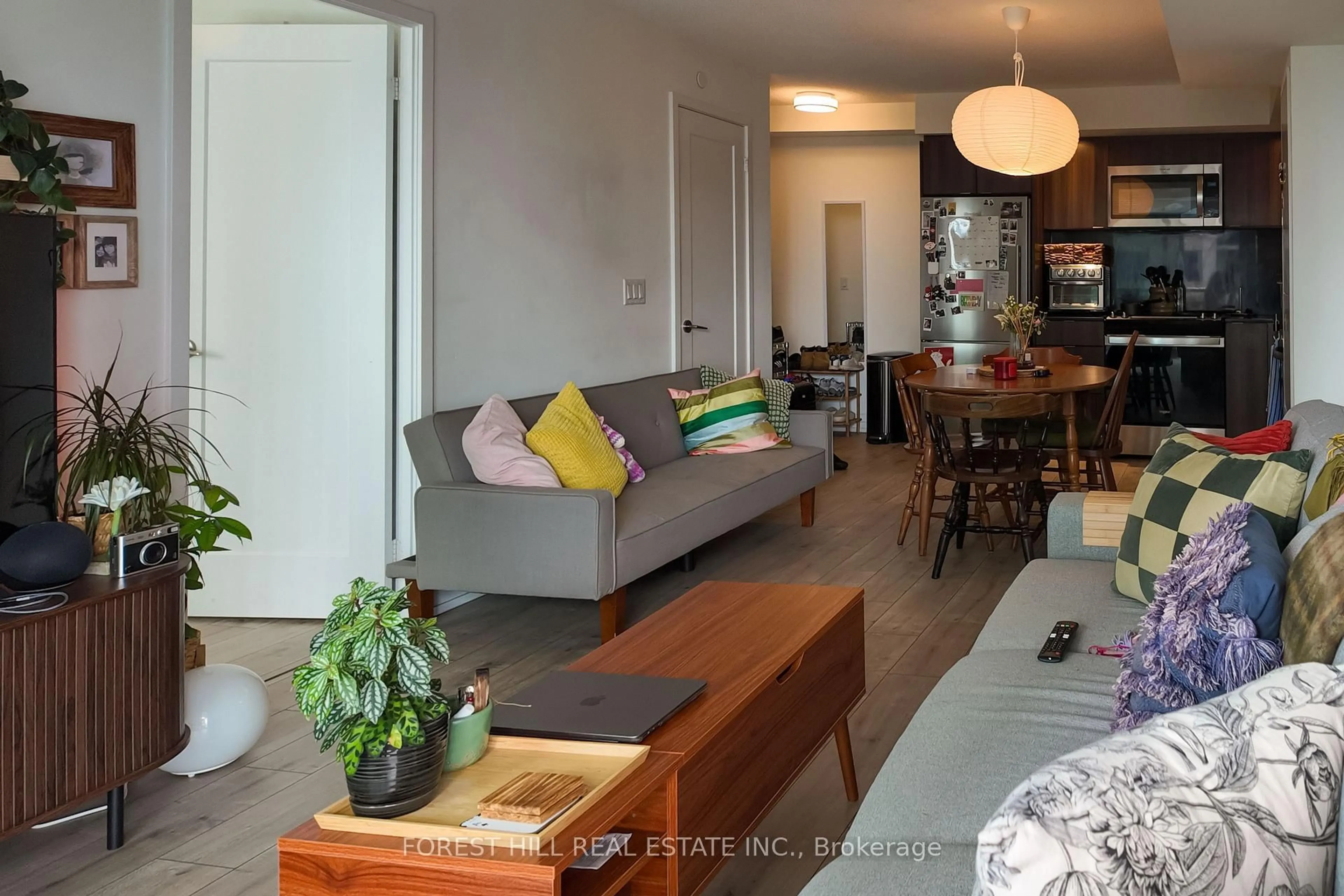 Living room with furniture, wood/laminate floor for 10 Eva Rd #1801, Toronto Ontario M9C 0B3