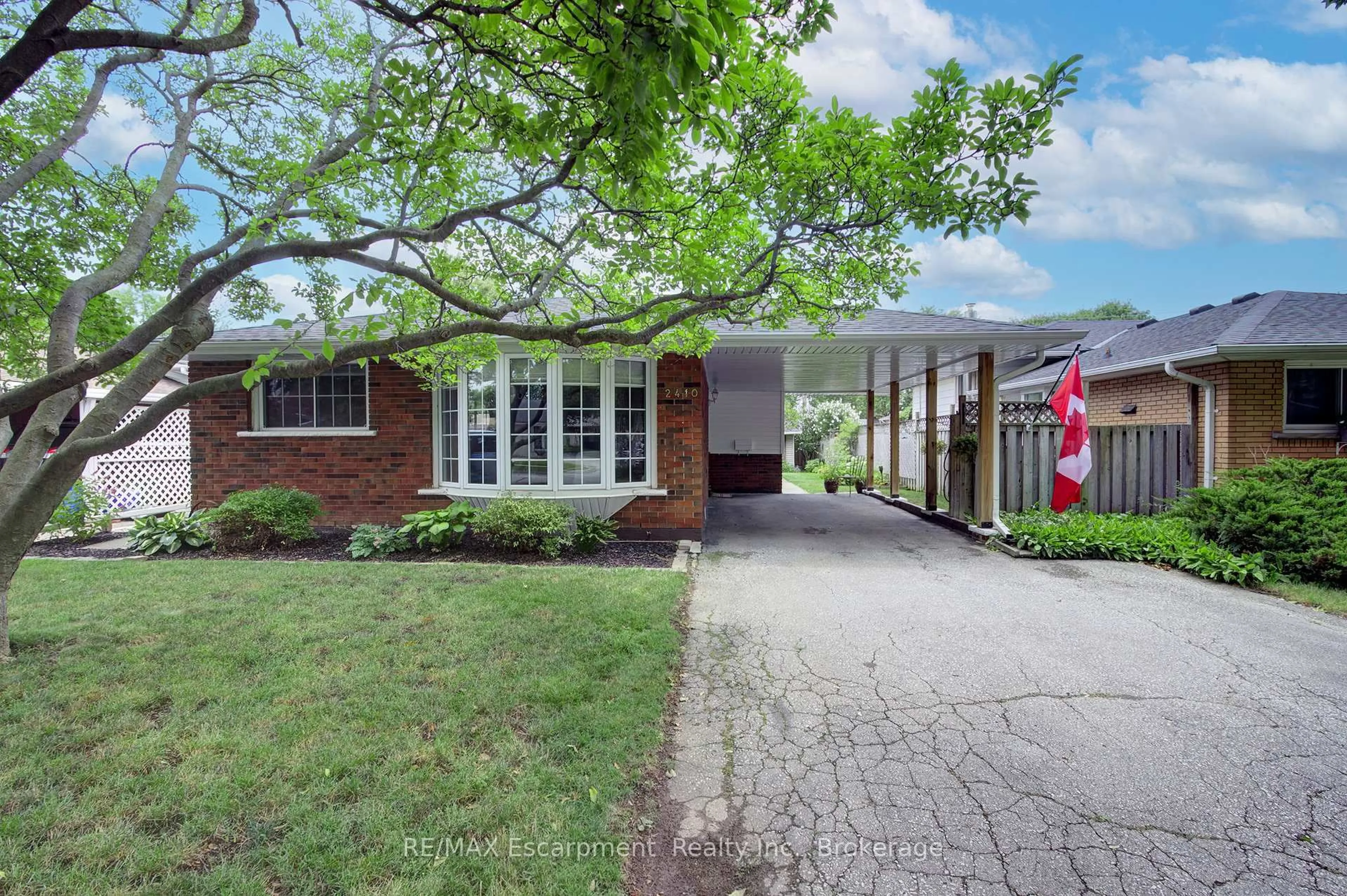 Home with brick exterior material, street for 2410 Tait Ave, Burlington Ontario L7P 1H1
