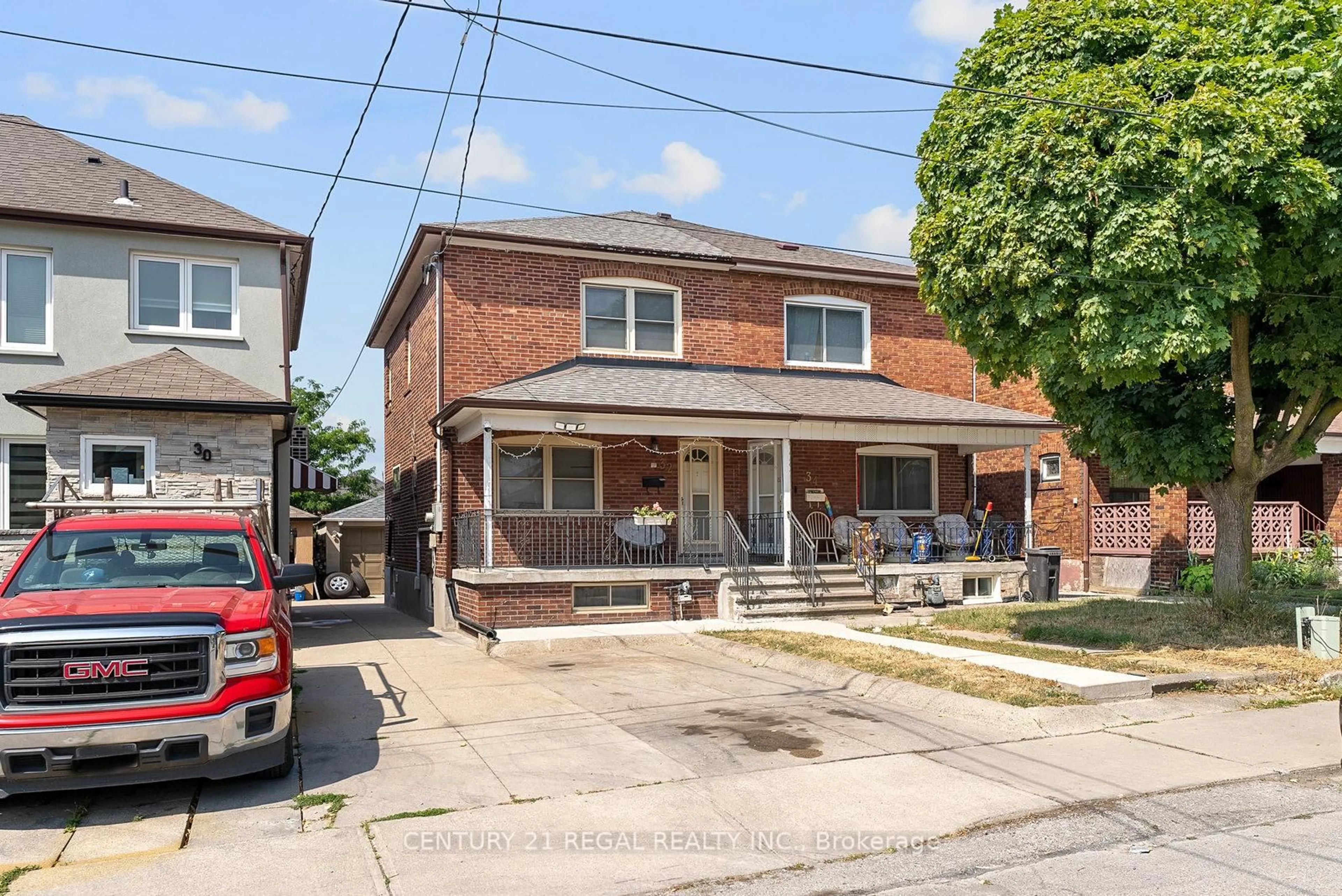 Home with brick exterior material, street for 32 Chamberlain Ave, Toronto Ontario M6E 4J8