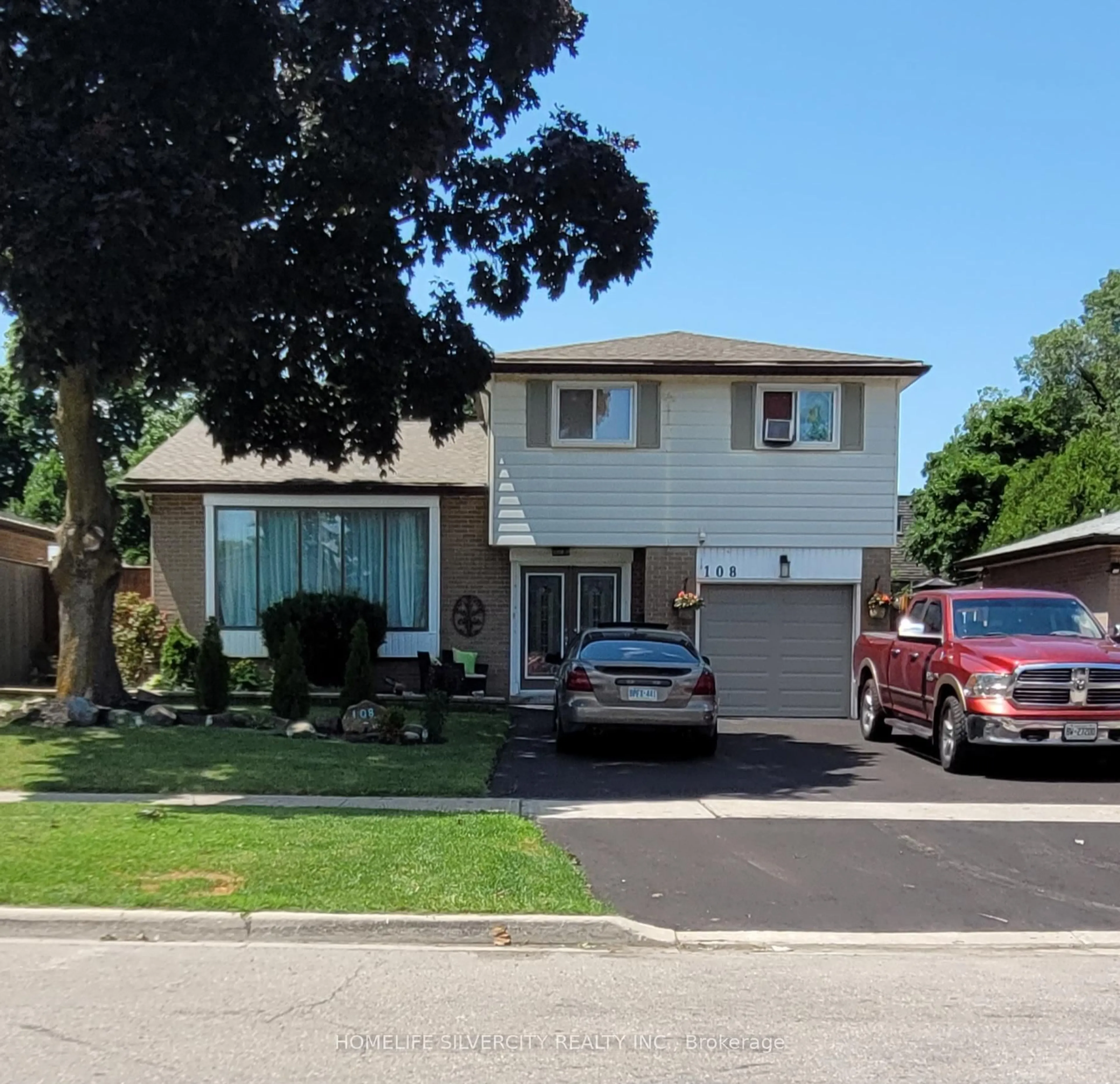 Home with vinyl exterior material, street for 108 Brookland Dr, Brampton Ontario L6T 2M5