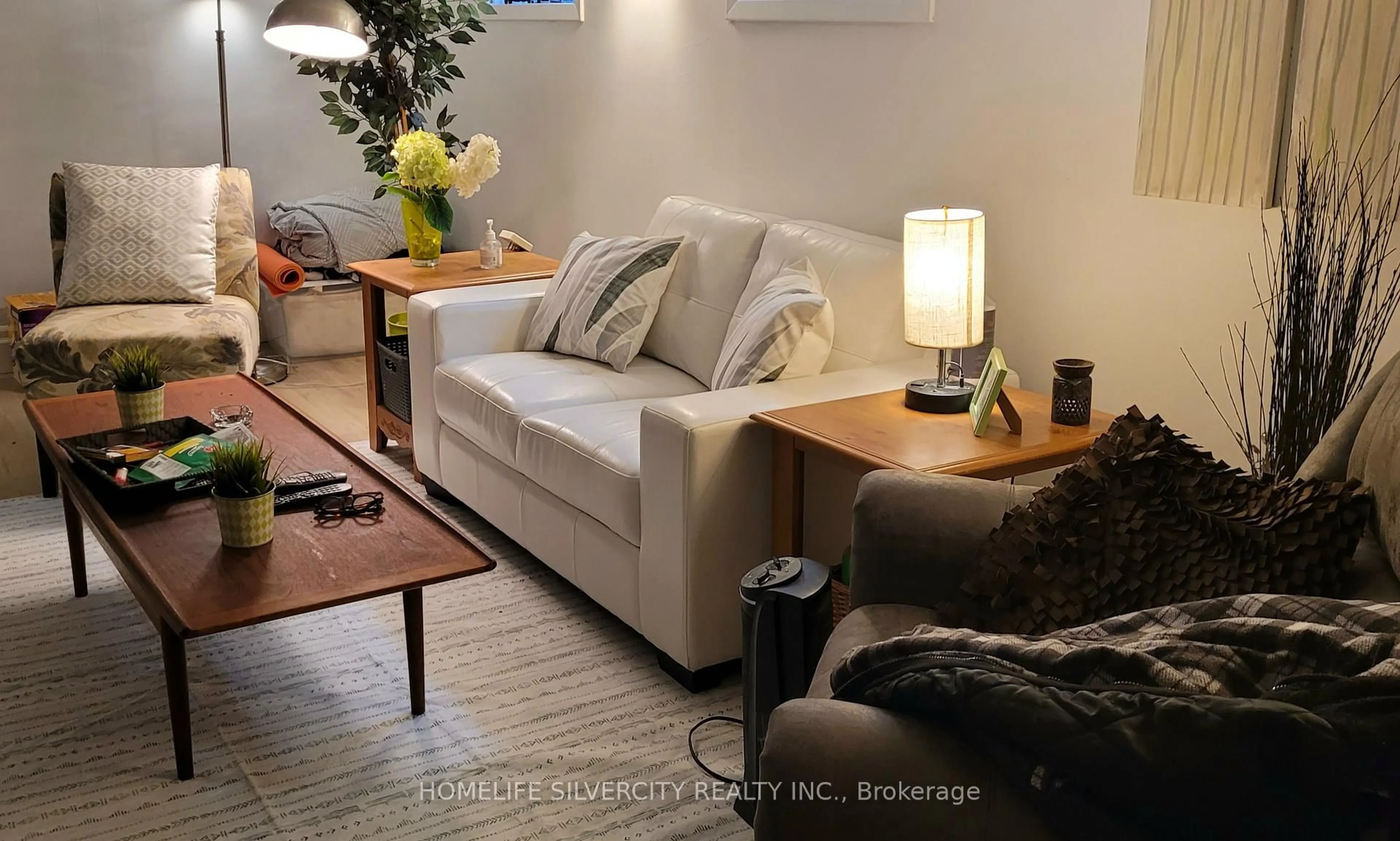 Living room with furniture, wood/laminate floor for 108 Brookland Dr, Brampton Ontario L6T 2M5