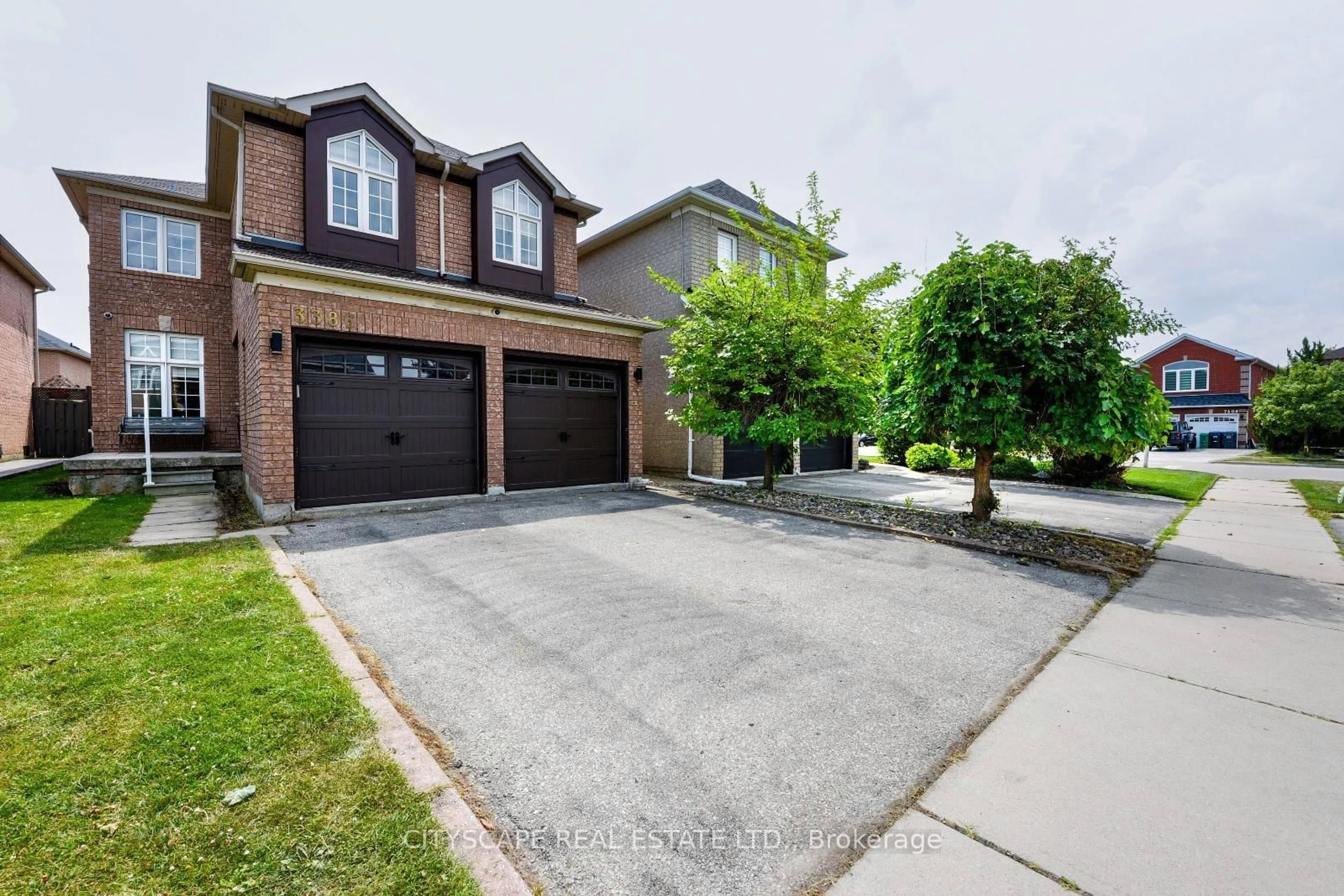 Home with brick exterior material, street for 3386 Gumwood Rd, Mississauga Ontario L5N 8A4