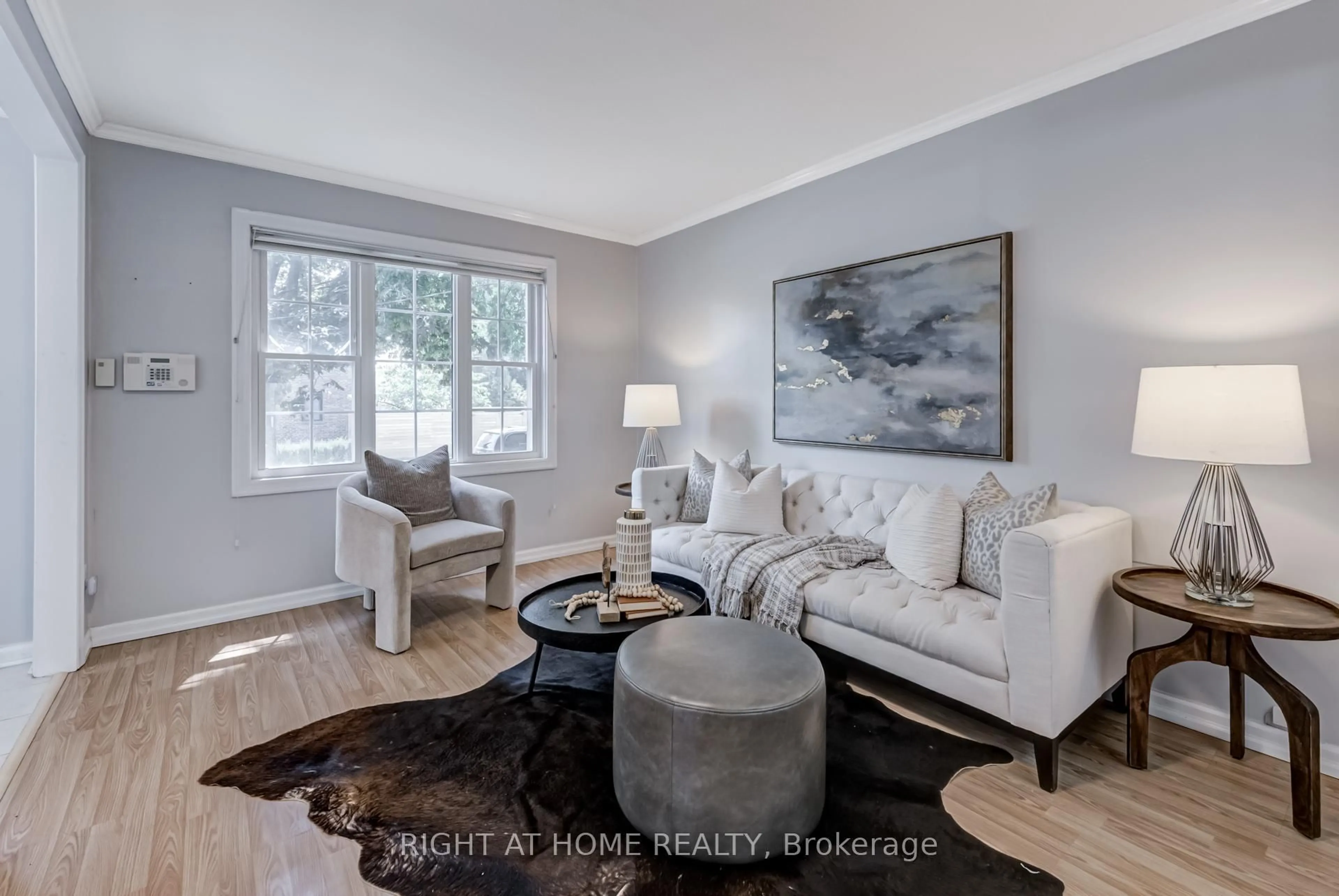 Living room with furniture, wood/laminate floor for 6 Struthers St, Toronto Ontario M8V 1Y1