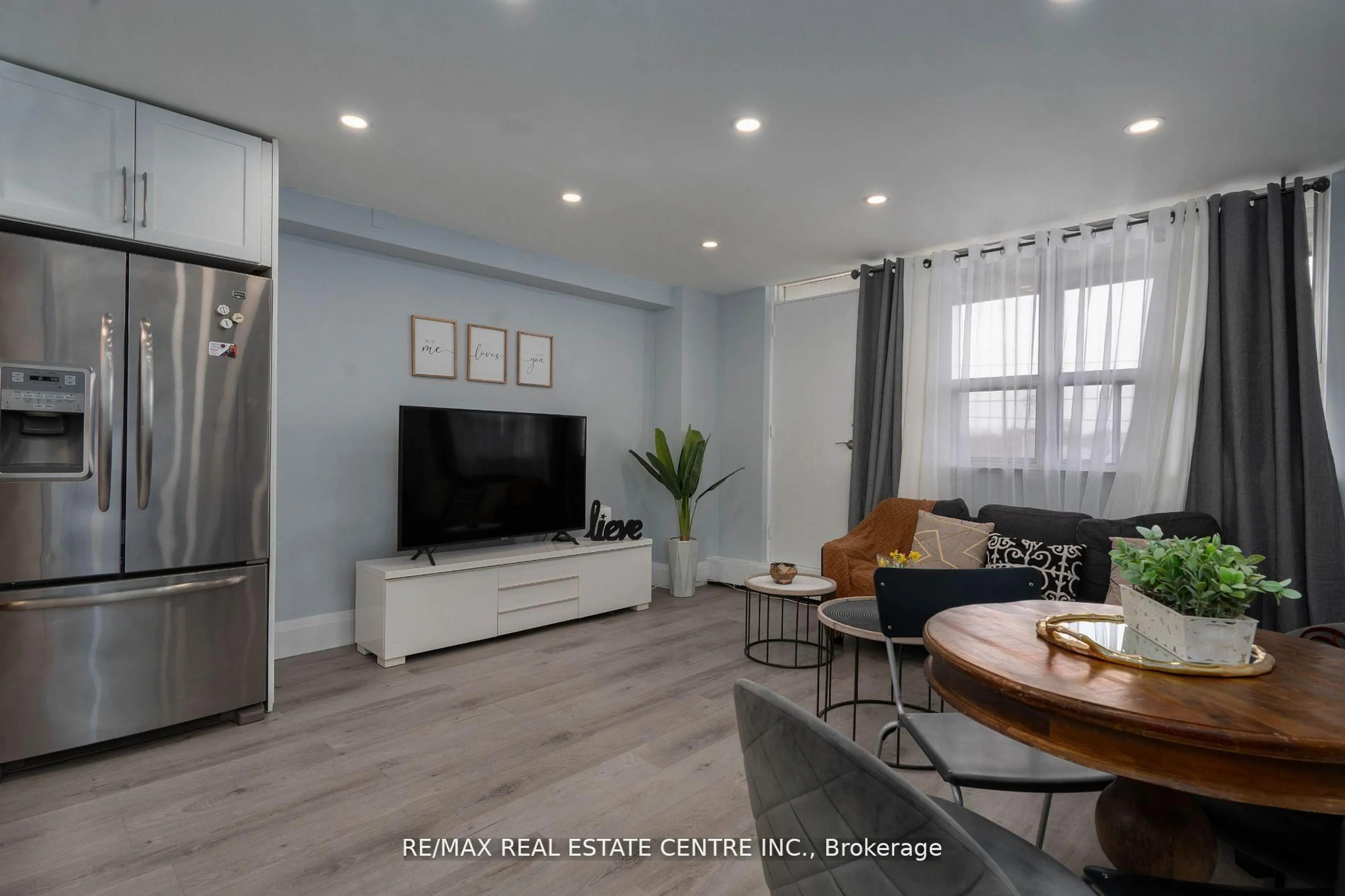 Living room with furniture, wood/laminate floor for 3621 Lakeshore Blvd #504, Toronto Ontario M9W 4W1
