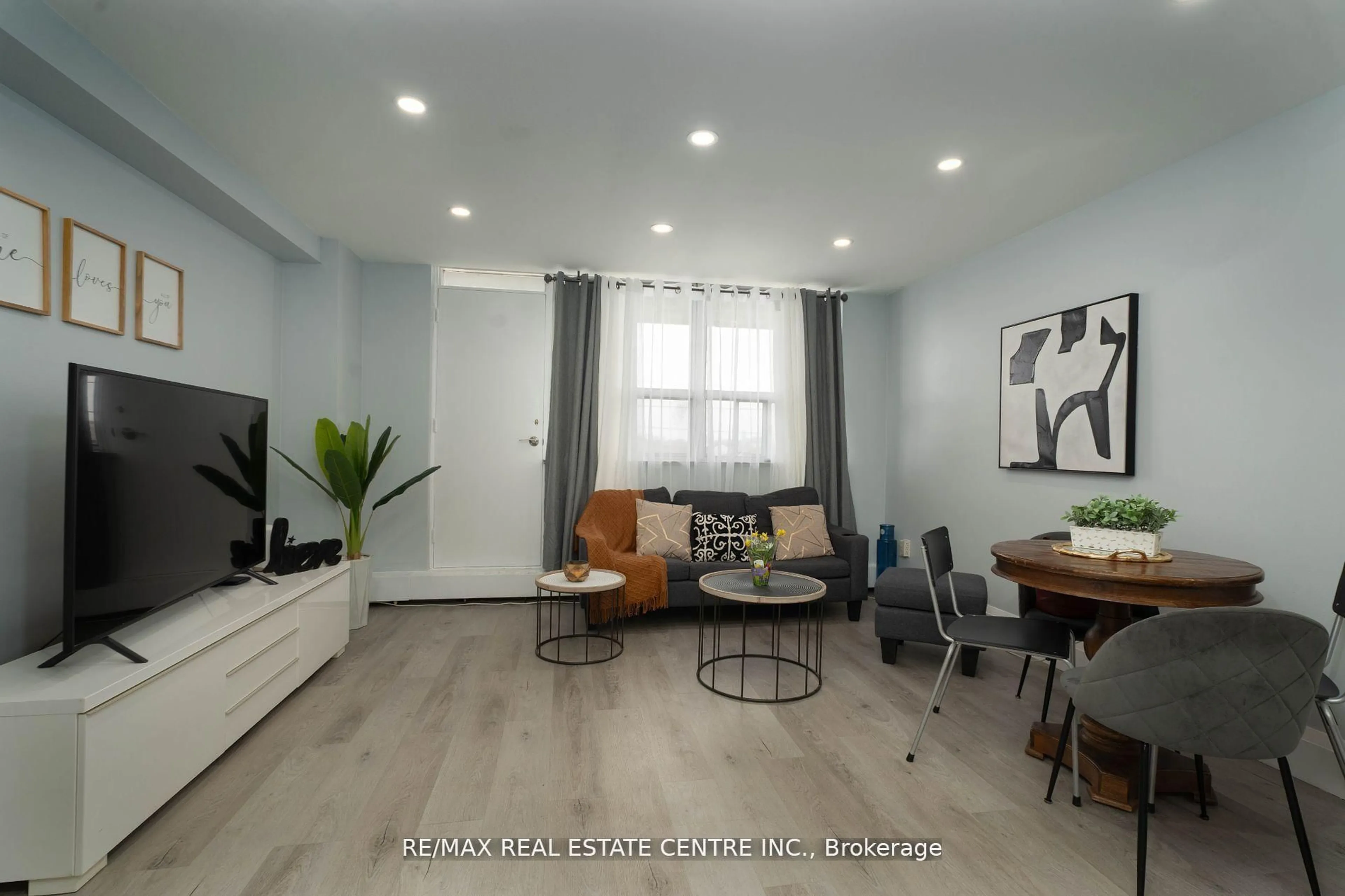 Living room with furniture, wood/laminate floor for 3621 Lakeshore Blvd #504, Toronto Ontario M9W 4W1