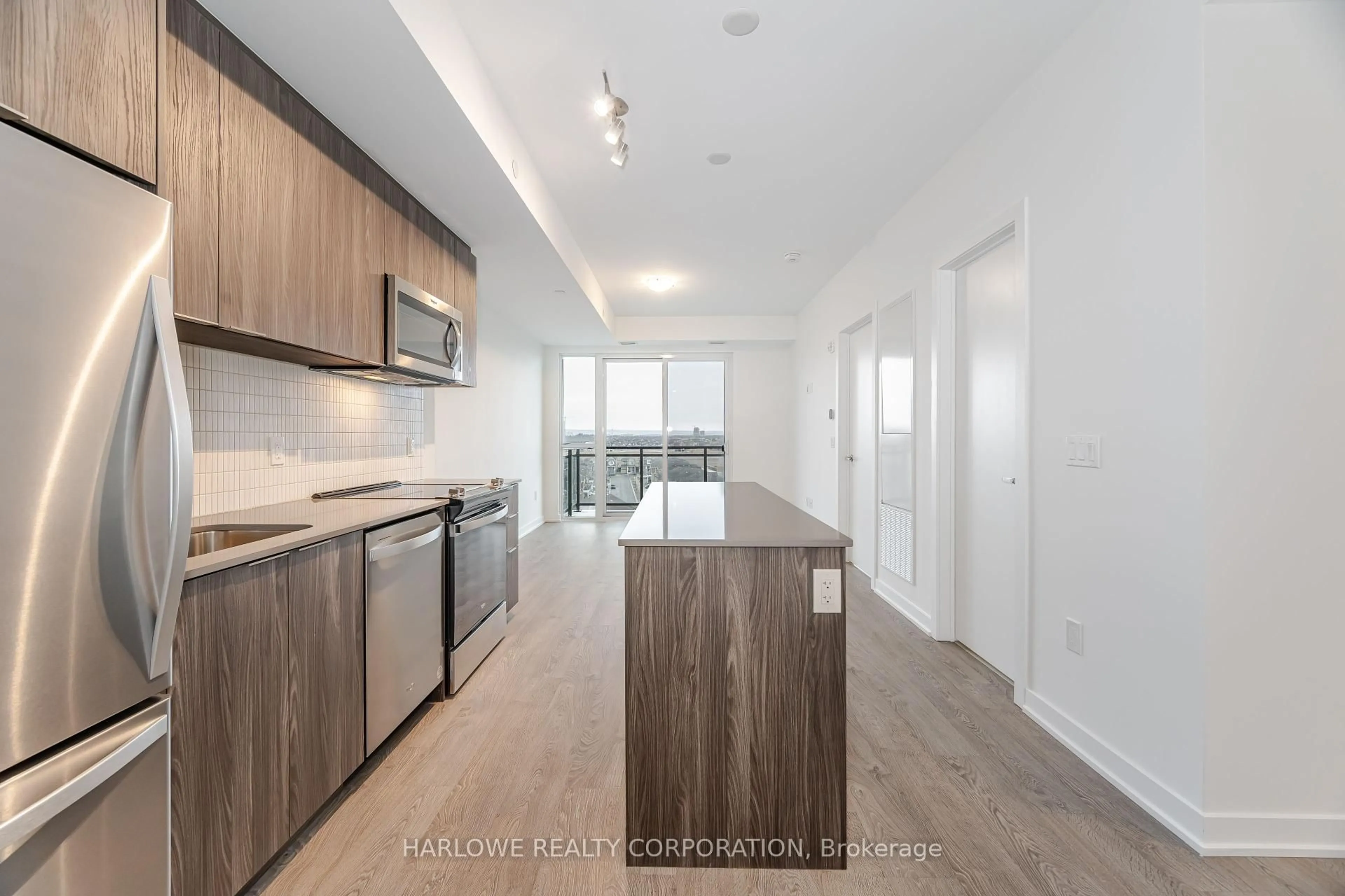 Open concept kitchen, wood/laminate floor for 770 Whitlock Ave #705, Milton Ontario L9E 1S2