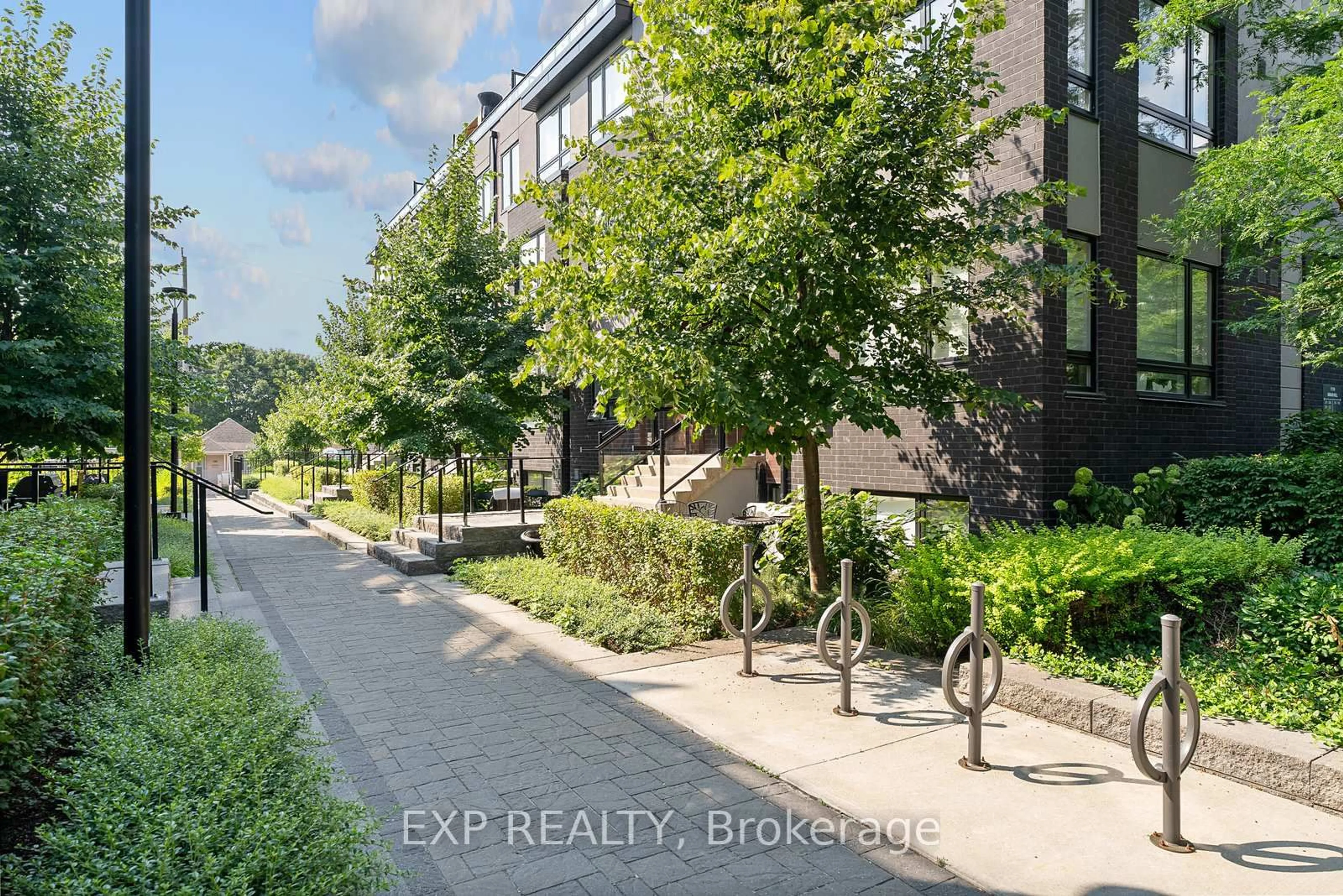 A pic from outside/outdoor area/front of a property/back of a property/a pic from drone, street for 1110 Briar Hill Ave #312, Toronto Ontario M6B 1M7