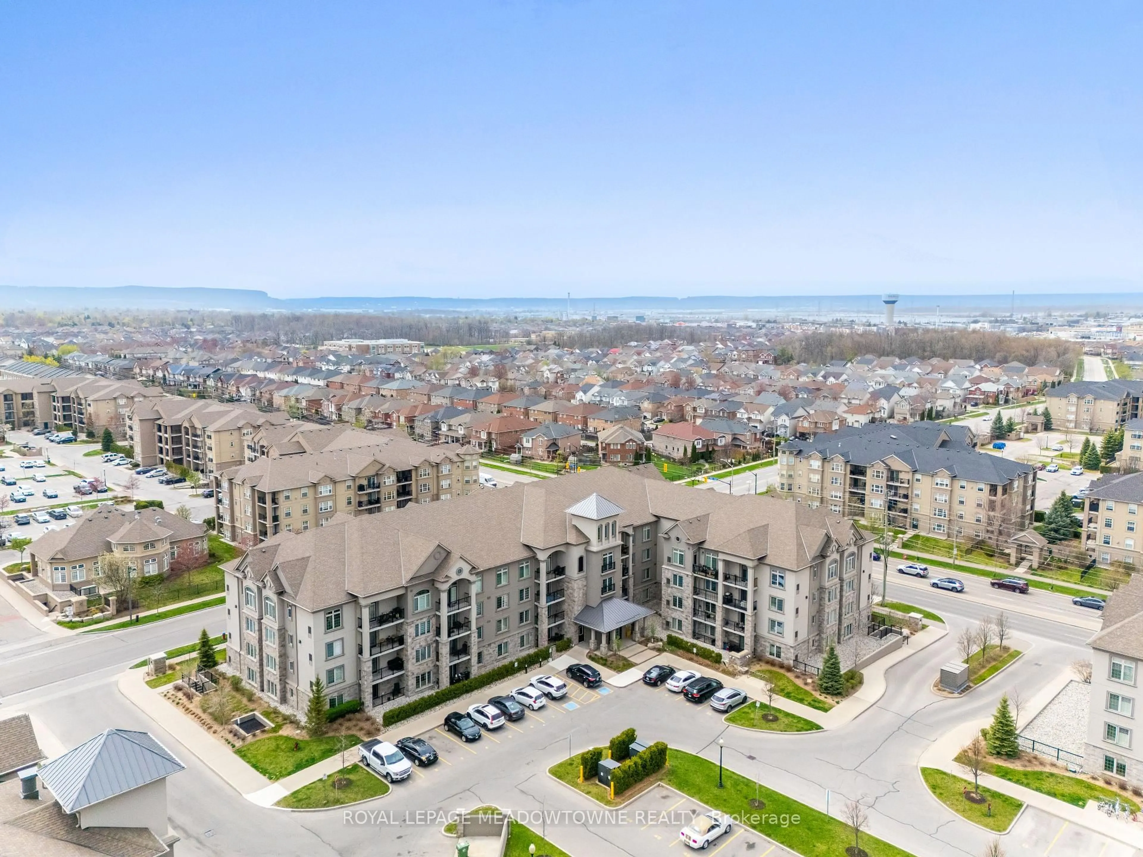 A pic from outside/outdoor area/front of a property/back of a property/a pic from drone, water/lake/river/ocean view for 1440 Main St #415, Milton Ontario L9T 8W3