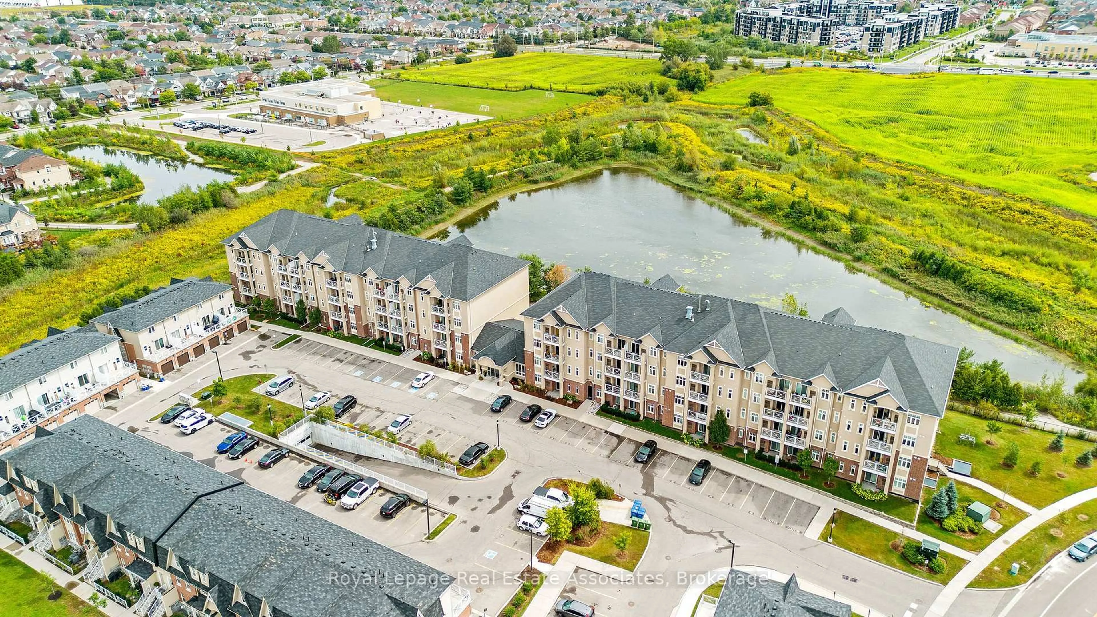 A pic from outside/outdoor area/front of a property/back of a property/a pic from drone, water/lake/river/ocean view for 1370 Costigan Rd #304, Milton Ontario L9T 0Y8