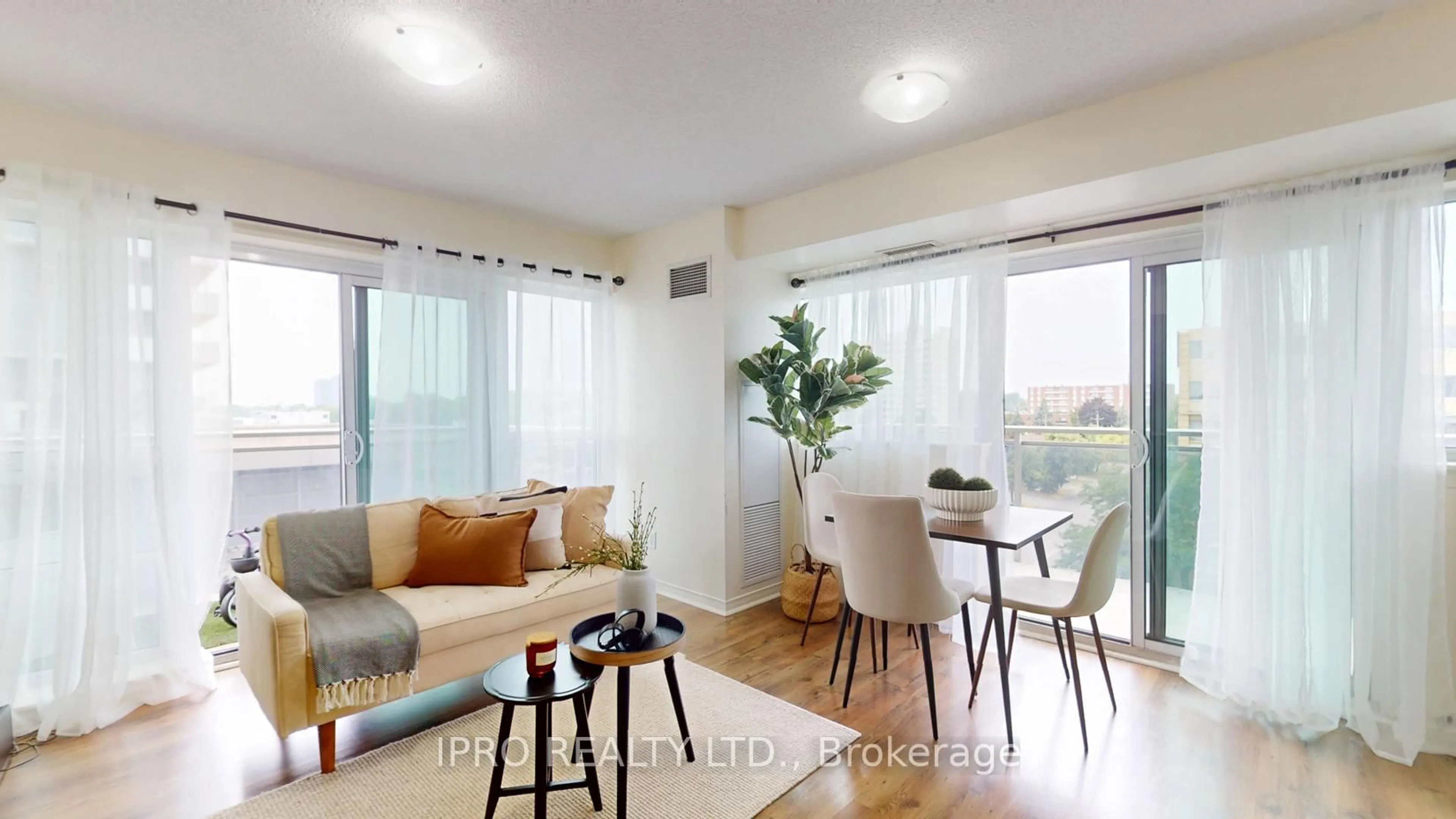 Living room with furniture, wood/laminate floor for 215 Queen St #509, Brampton Ontario L6Y 1M6