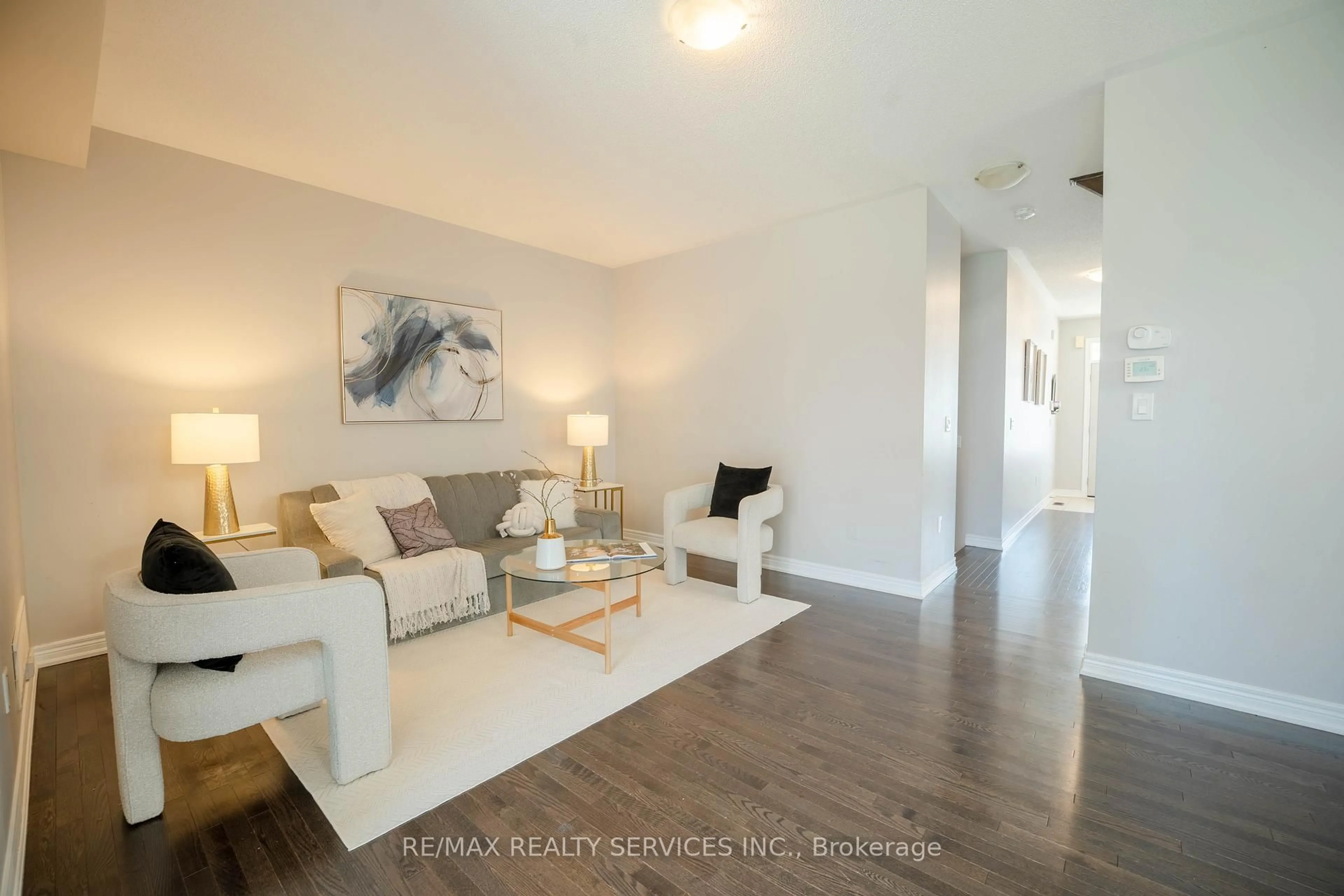 Living room with furniture, wood/laminate floor for 15 Ebury Dr, Brampton Ontario L6X 5M4