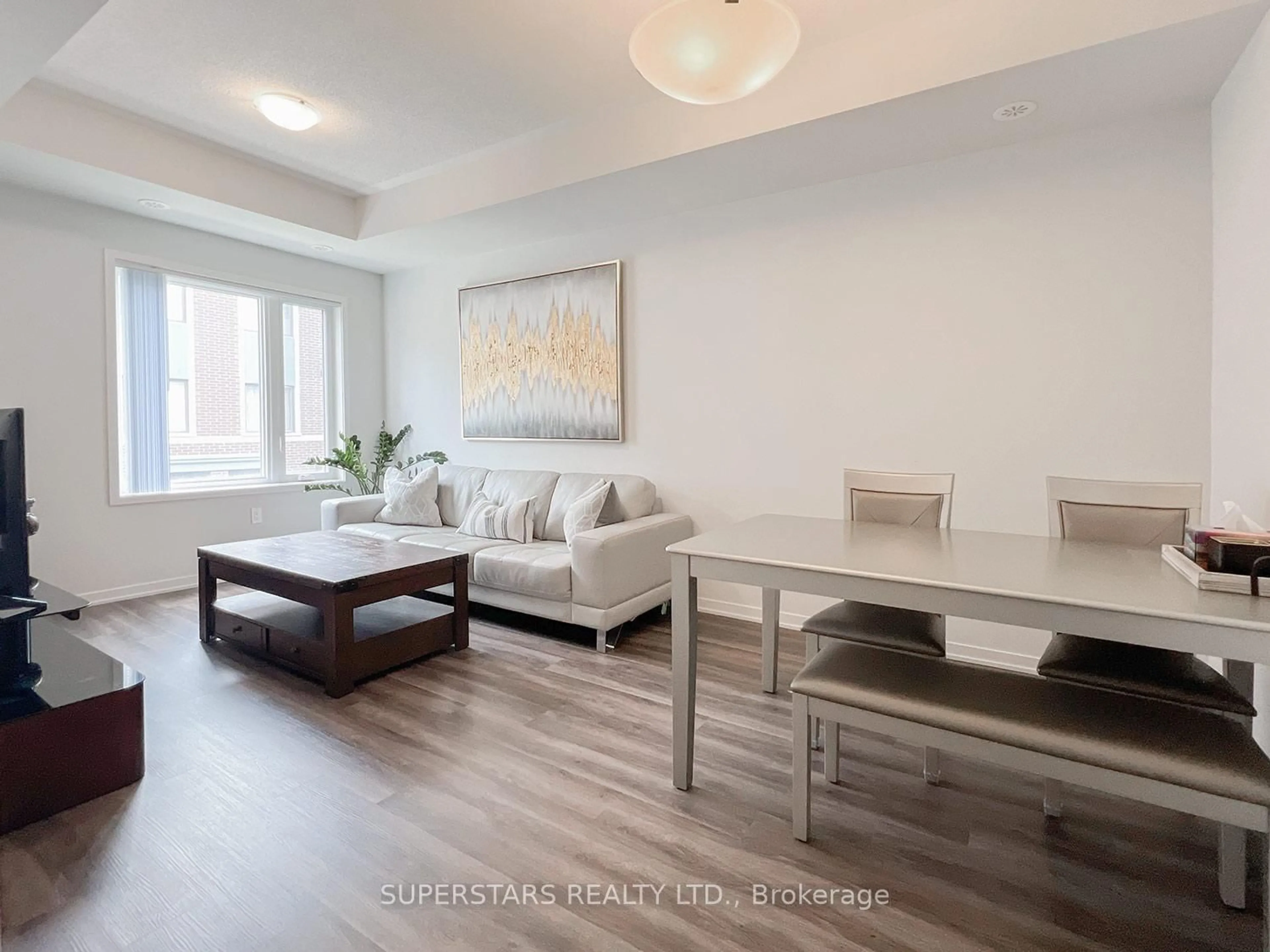 Living room with furniture, wood/laminate floor for 225 Birmingham St #158, Toronto Ontario M8V 2C7