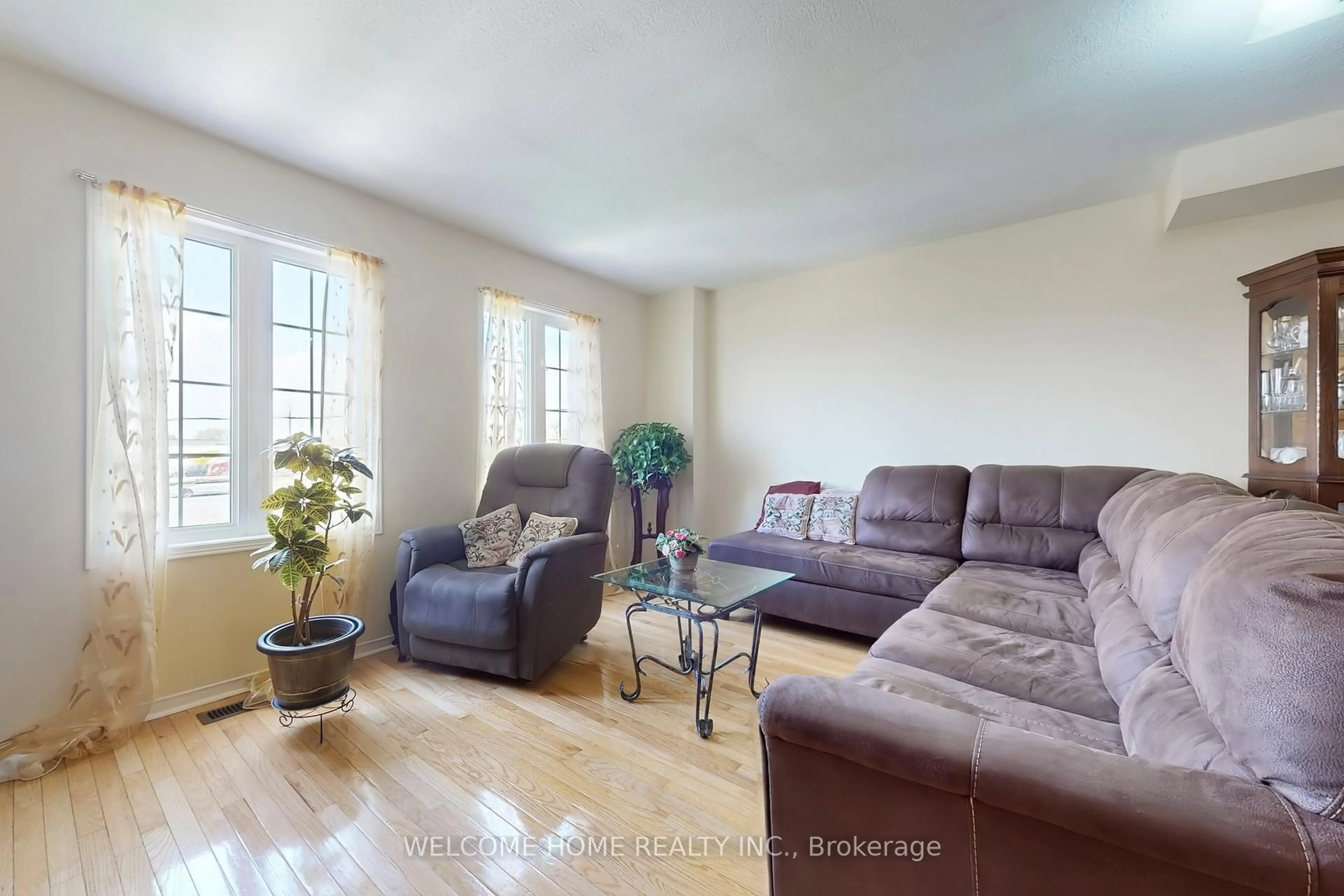 Living room with furniture, wood/laminate floor for 107 Torbarrie Rd, Toronto Ontario M3L 1G8