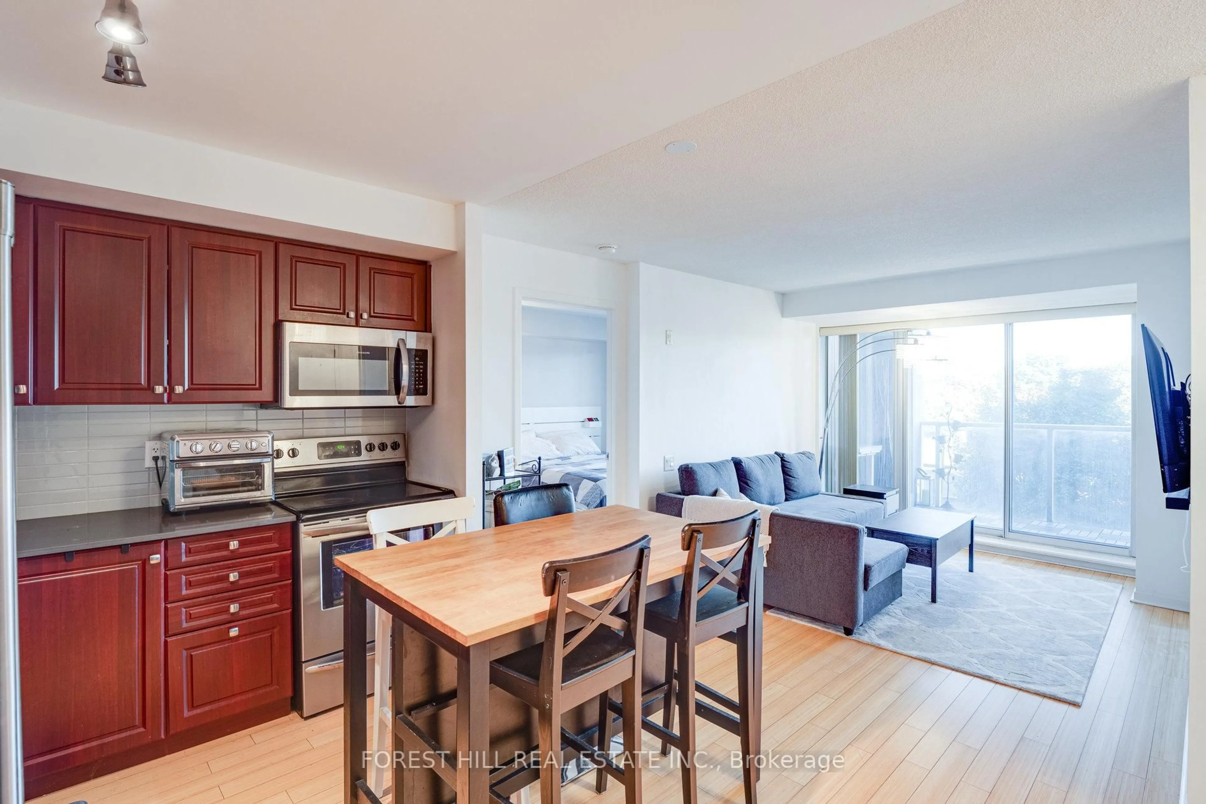 Open concept kitchen, wood/laminate floor for 1040 The Queensway Ave #301, Toronto Ontario M8Z 0A7
