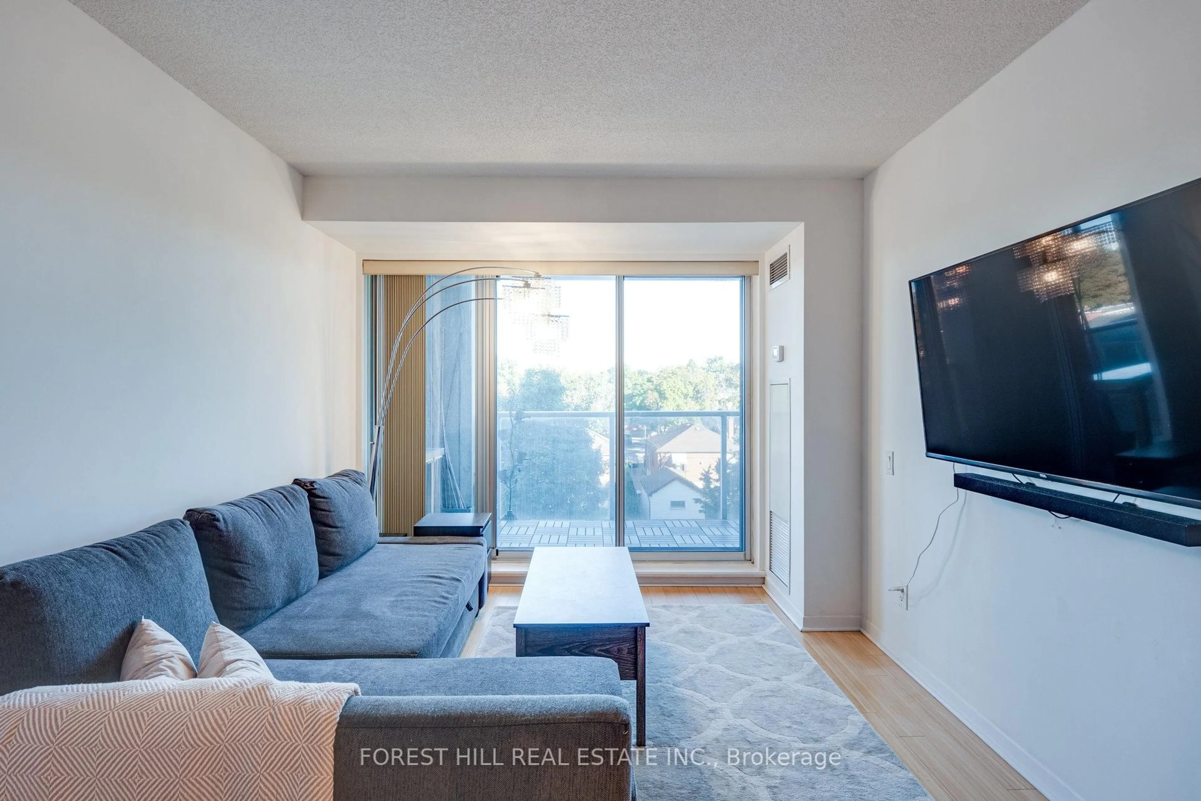 Living room with furniture, wood/laminate floor for 1040 The Queensway Ave #301, Toronto Ontario M8Z 0A7