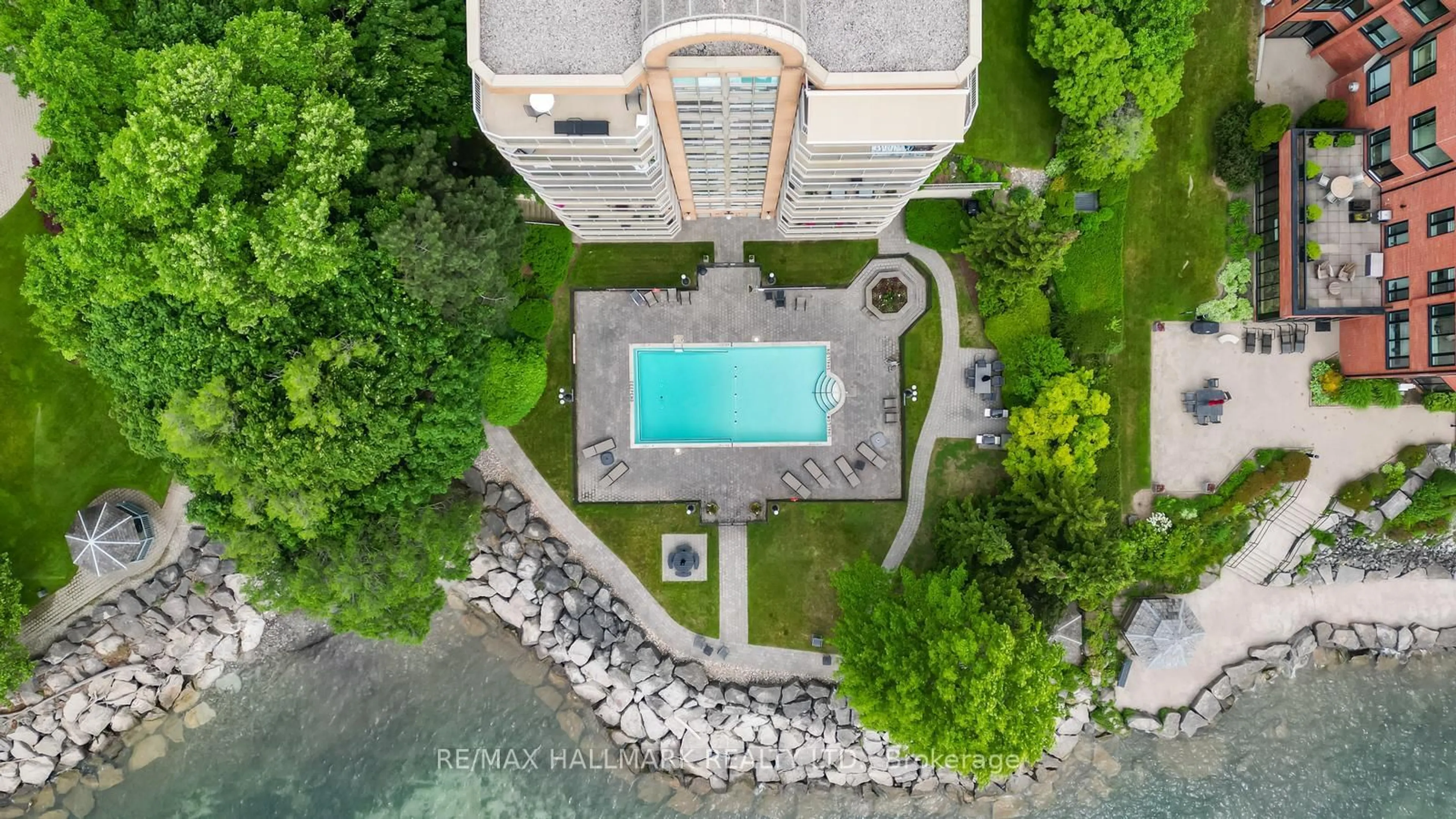 A pic from outside/outdoor area/front of a property/back of a property/a pic from drone, water/lake/river/ocean view for 2210 Lakeshore Rd #104, Burlington Ontario L7R 4J9