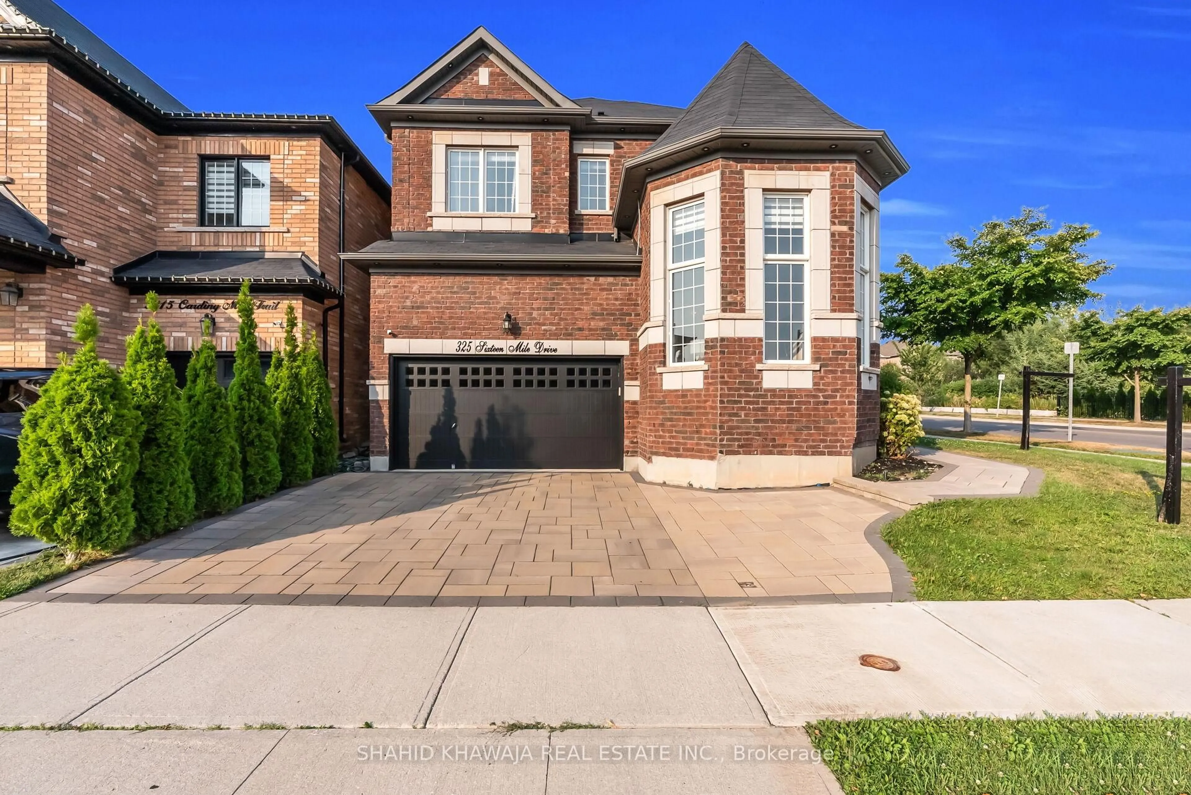 Home with brick exterior material, street for 325 Sixteen Mile Dr, Oakville Ontario L6M 0Z4
